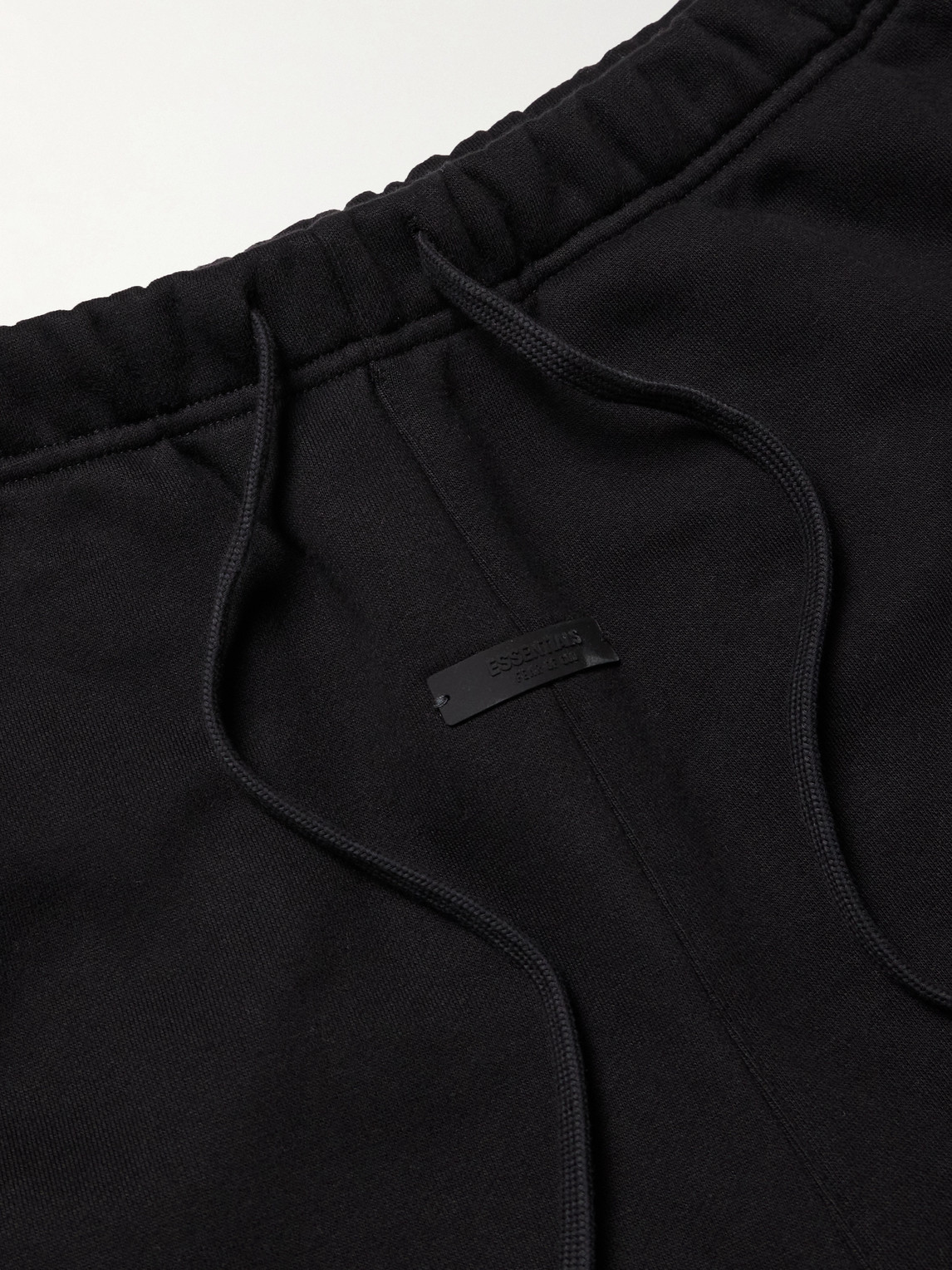 Essentials Tapered Logo-print Appliquéd Cotton-blend Jersey Sweatpants In Black