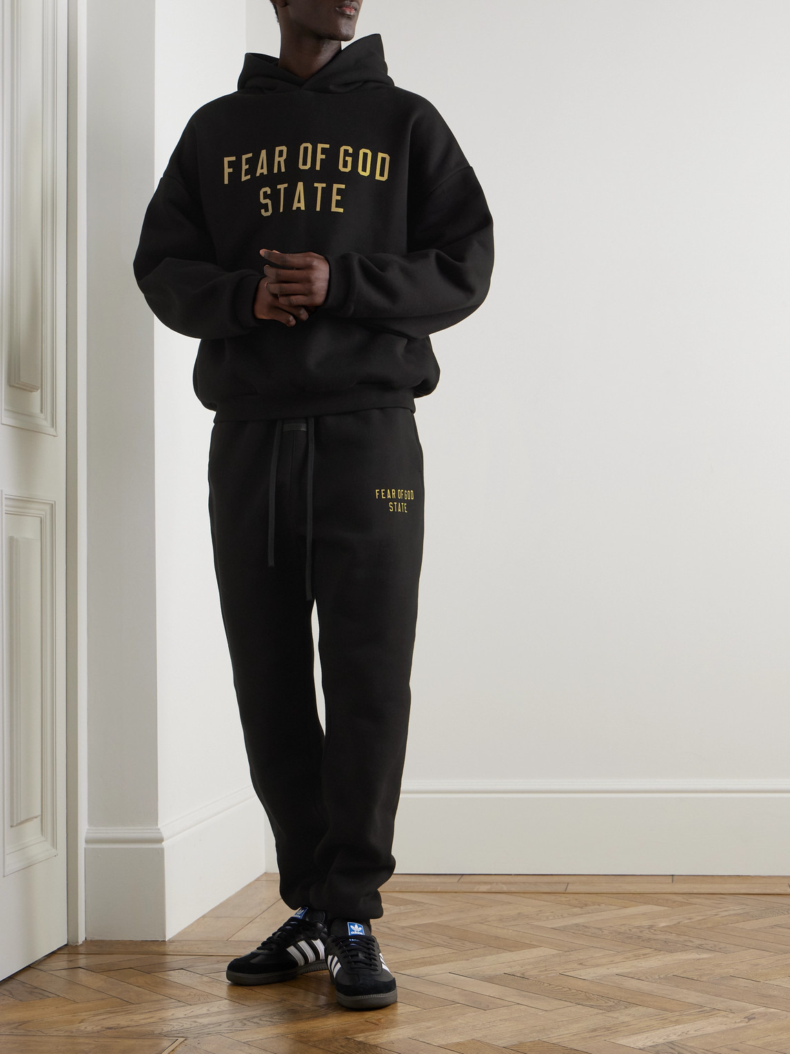 Essentials Tapered Logo-print Appliquéd Cotton-blend Jersey Sweatpants In Black