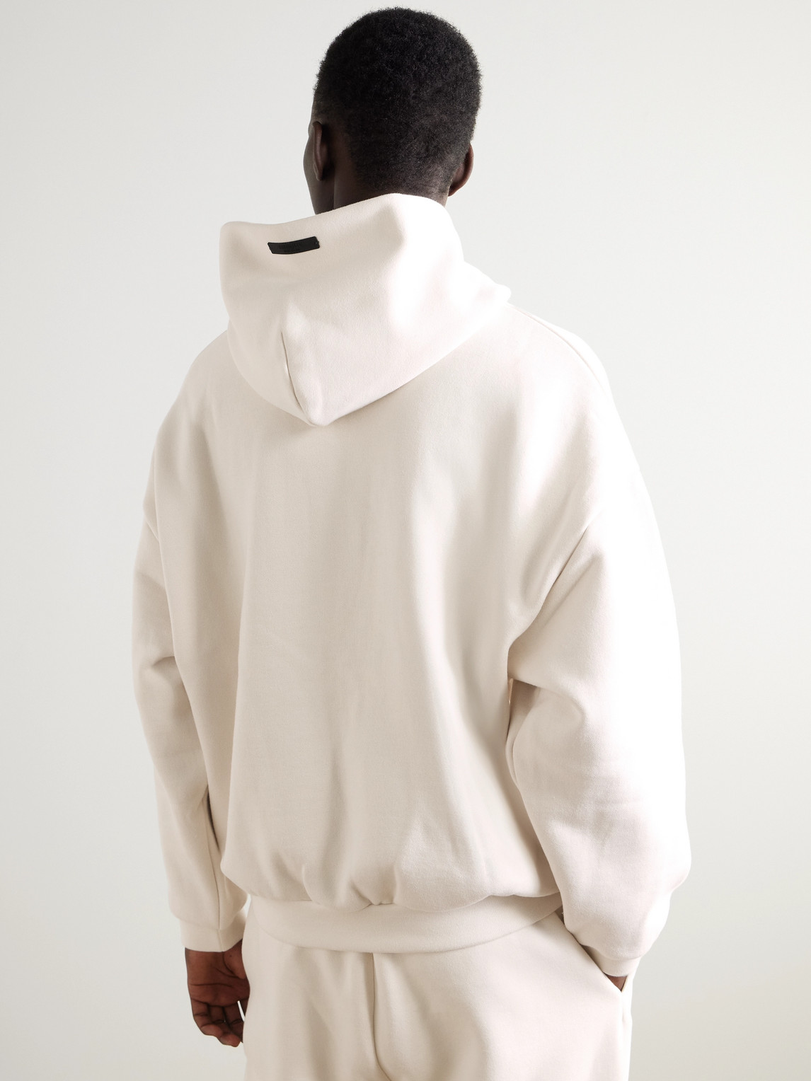 ESSENTIALS OVERSIZED LOGO-PRINT COTTON-BLEND JERSEY HOODIE 