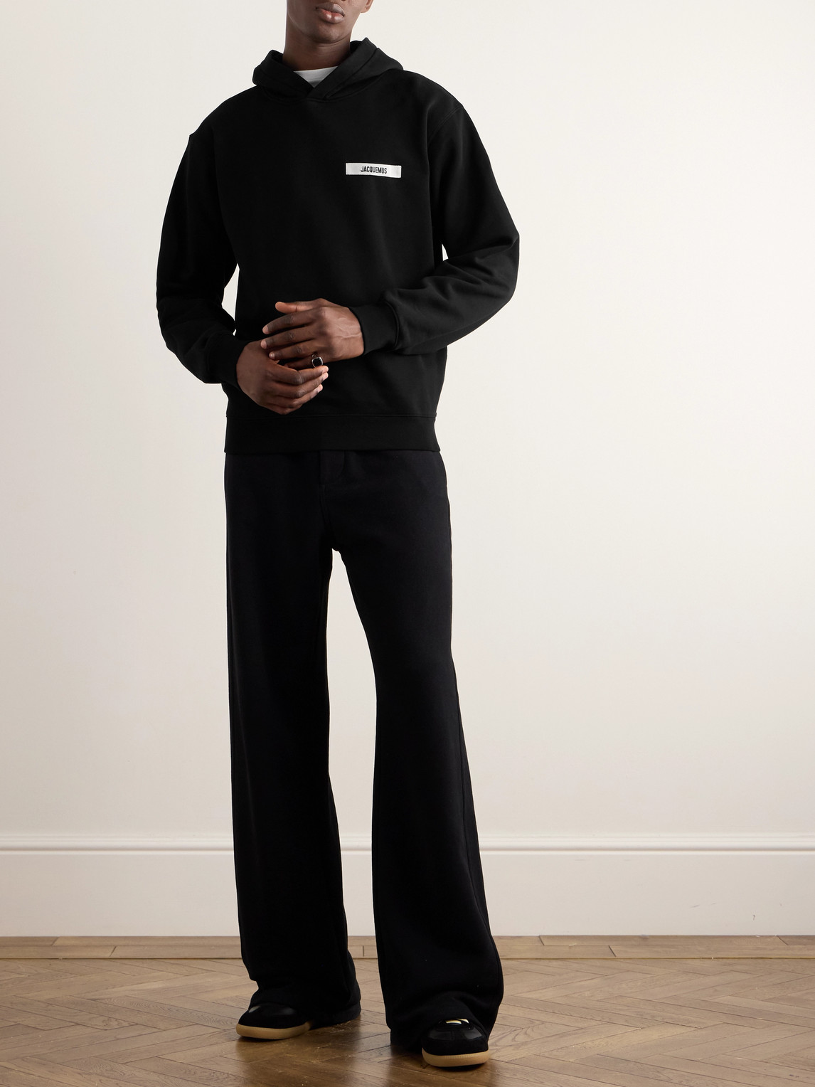 Shop Jacquemus Logo-appliquéd Cotton-jersey Hoodie In Black