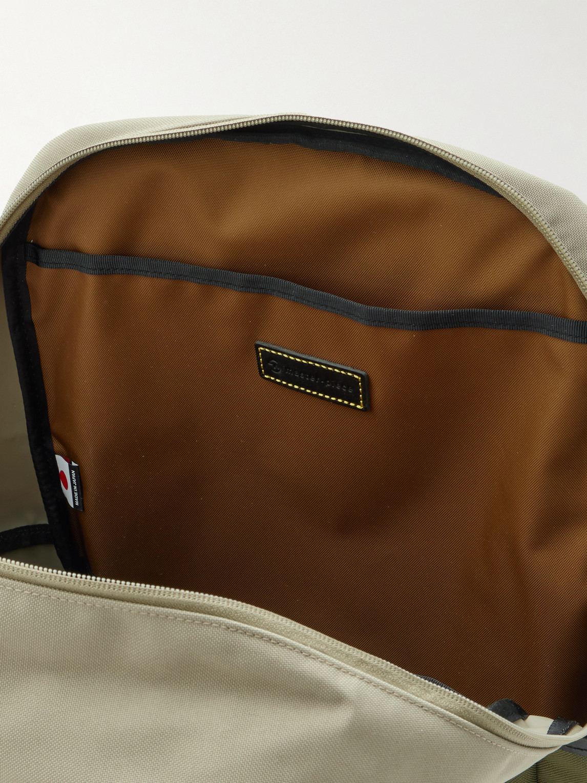 Master-piece Defend Leather-trimmed Coated-canvas Backpack In Green