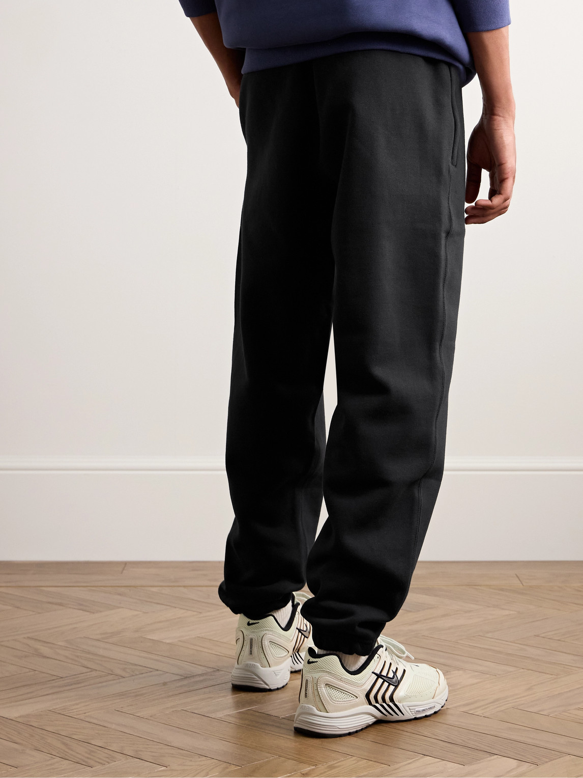Shop Nike Solo Swoosh Tapered Logo-embroidered Cotton-blend Jersey Sweatpants In Black