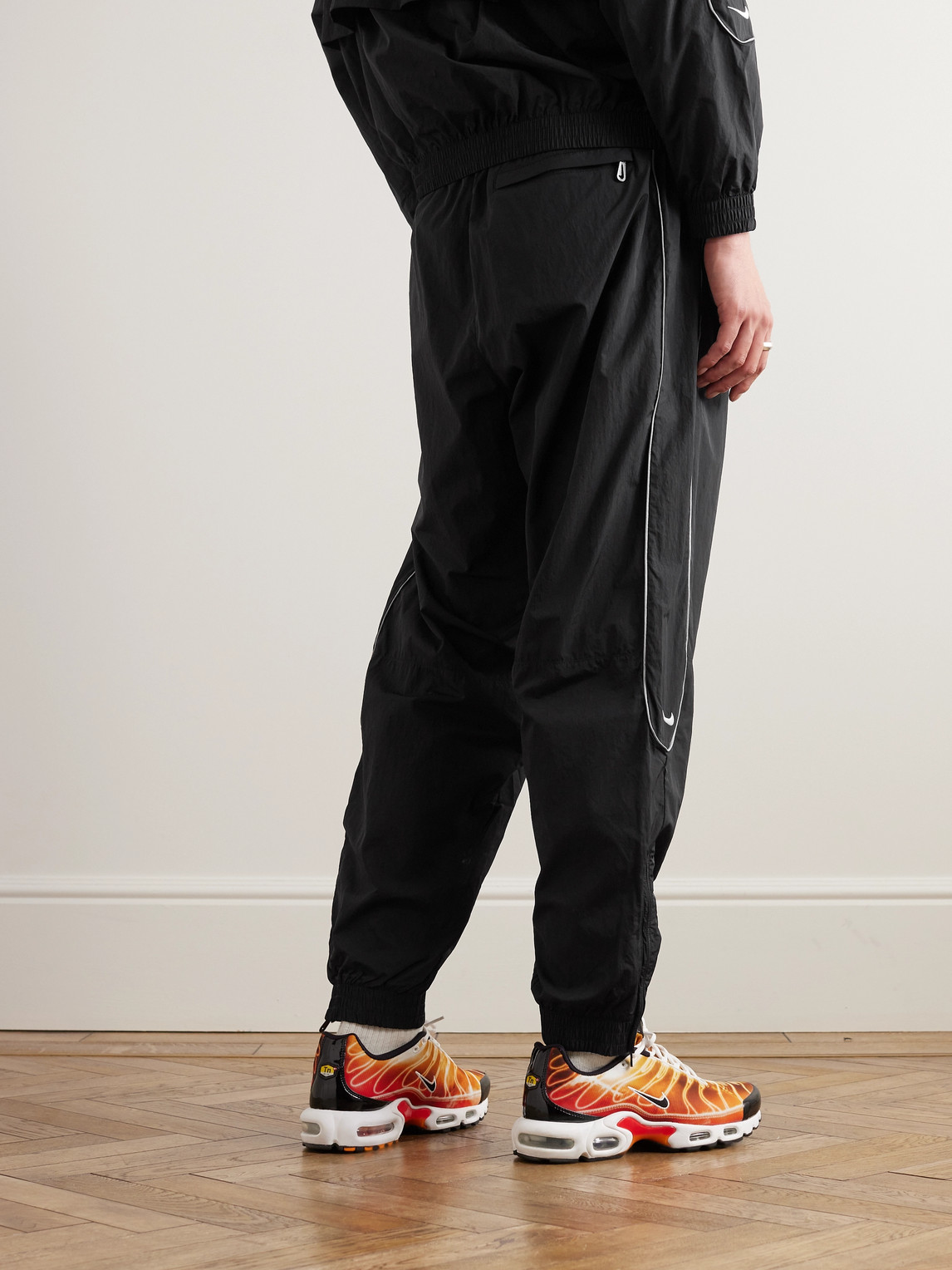 Shop Nike Solo Swoosh Tapered Logo-embroidered Taffeta Track Pants In Black