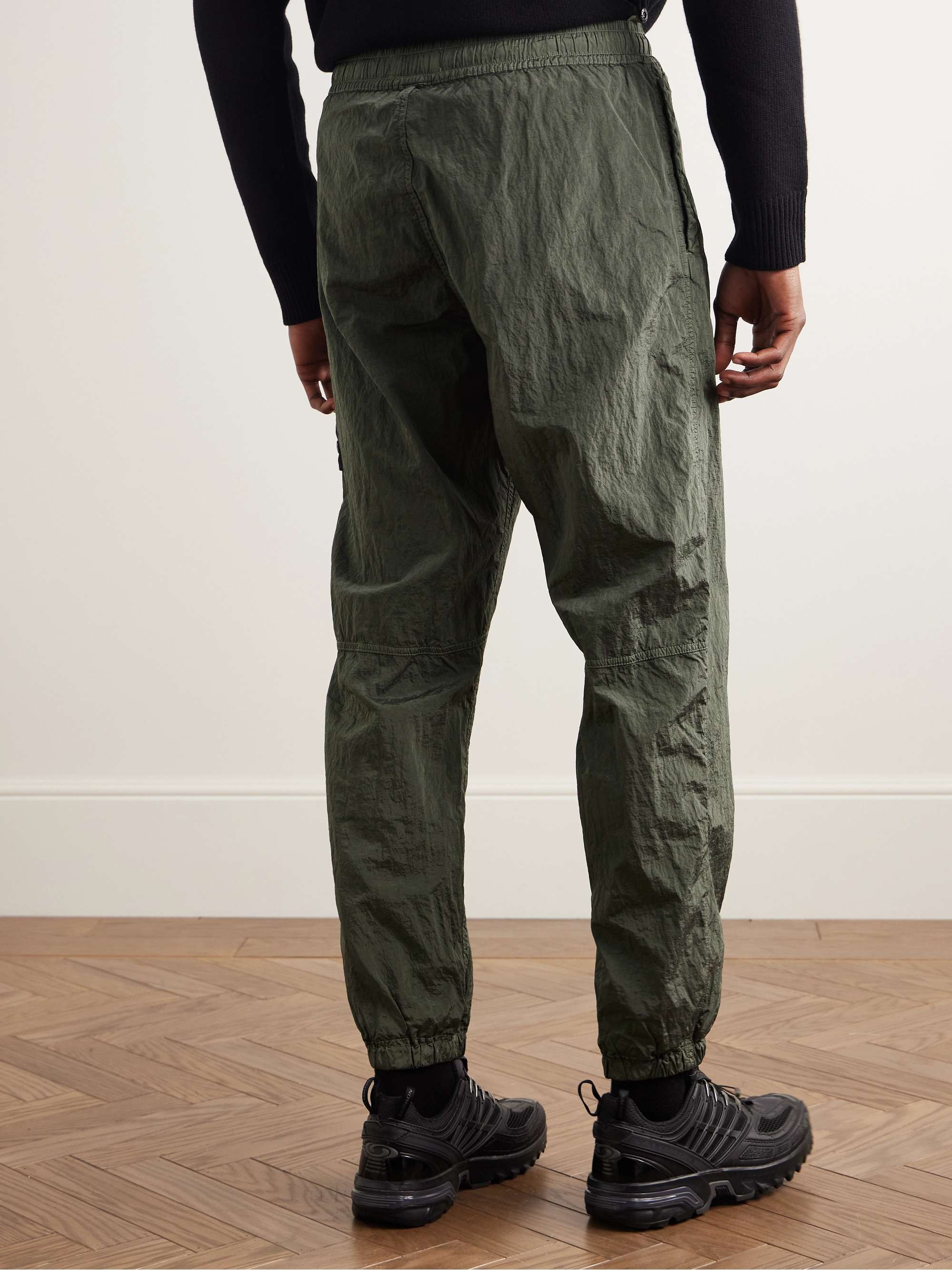 STONE ISLAND Tapered Logo-Appliquéd Nylon Metal Track Pants STONE ISLAND Tapered Logo-Appliquéd Nylon Metal Track Pants