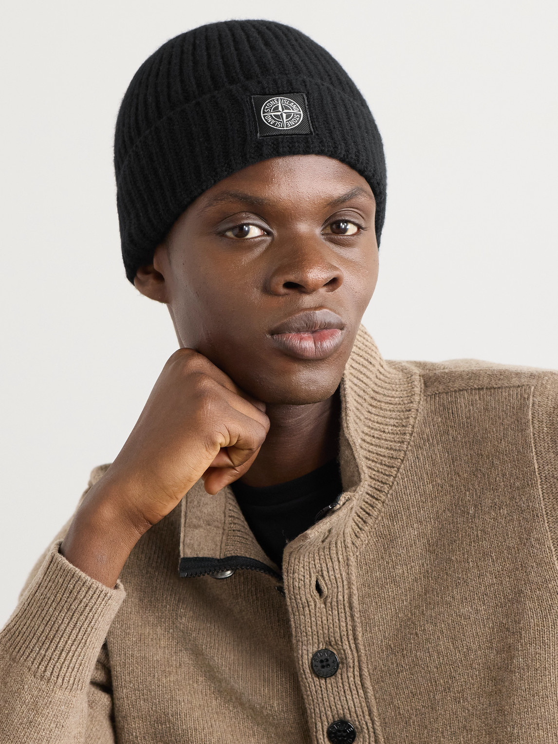 Stone Island Logo-appliquéd Ribbed Wool Beanie In Black