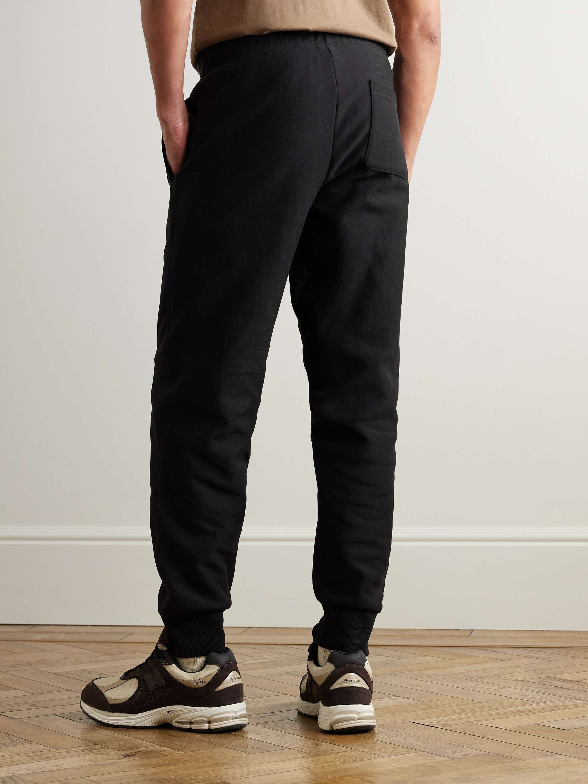 CARHARTT WIP Pantaloni sportivi a gamba affusolata in jersey di misto cotone American Script