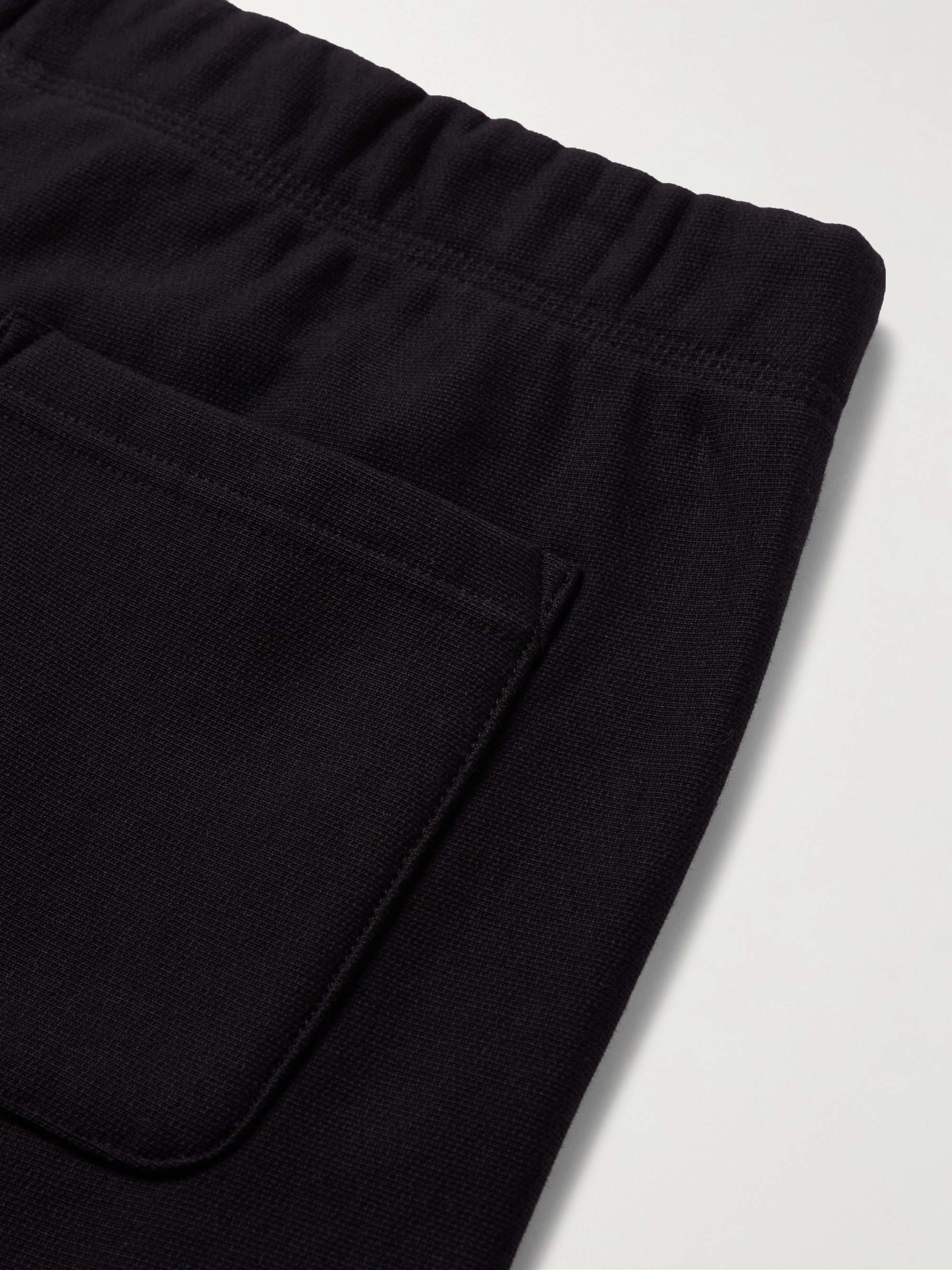 CARHARTT WIP Pantaloni sportivi a gamba affusolata in jersey di misto cotone American Script