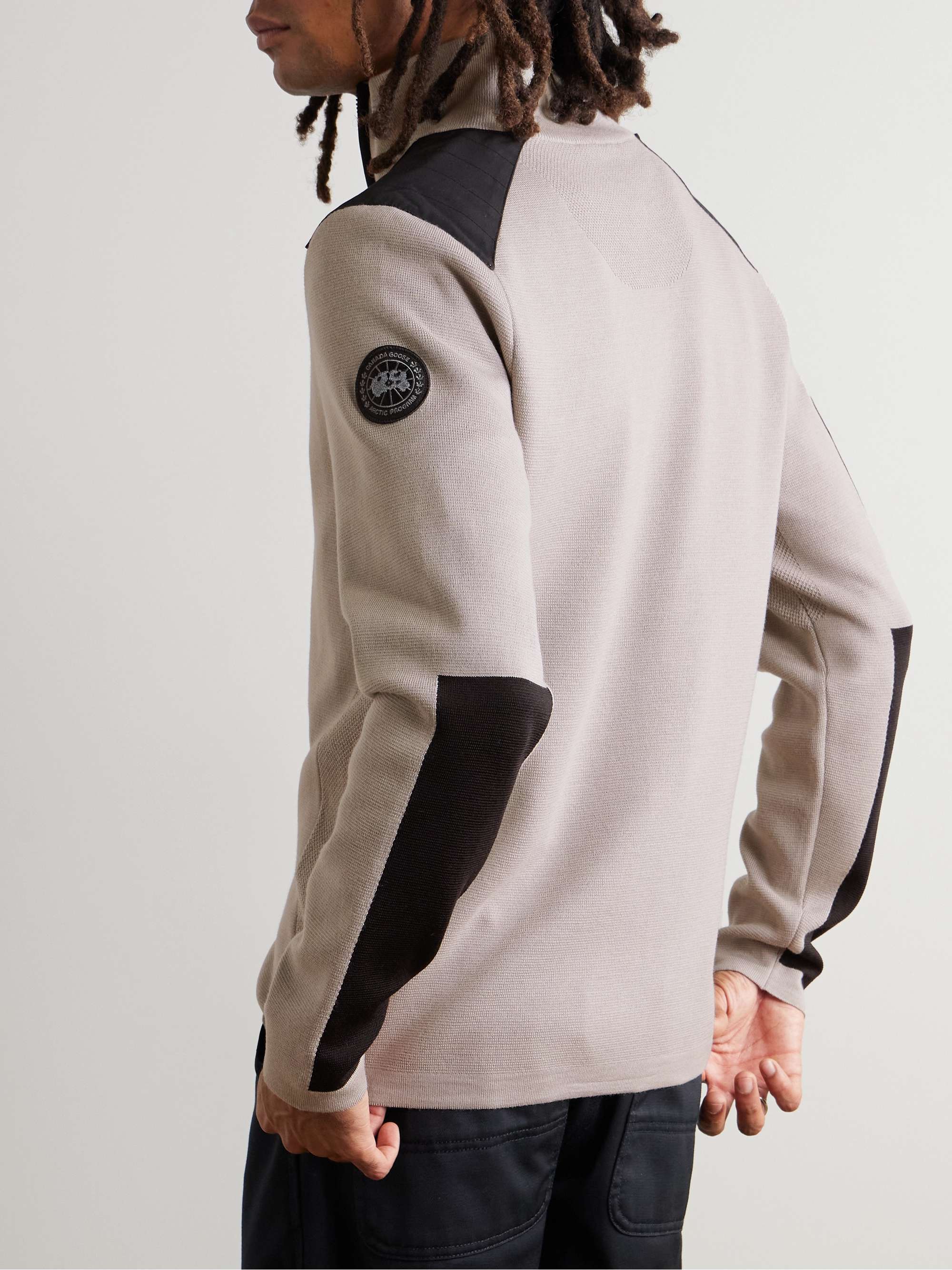 CANADA GOOSE كنزة Stormont بسحّاب نصفي وقصّة ضيّقة من صوف المارينو بحاشية من نسيج CORDURA