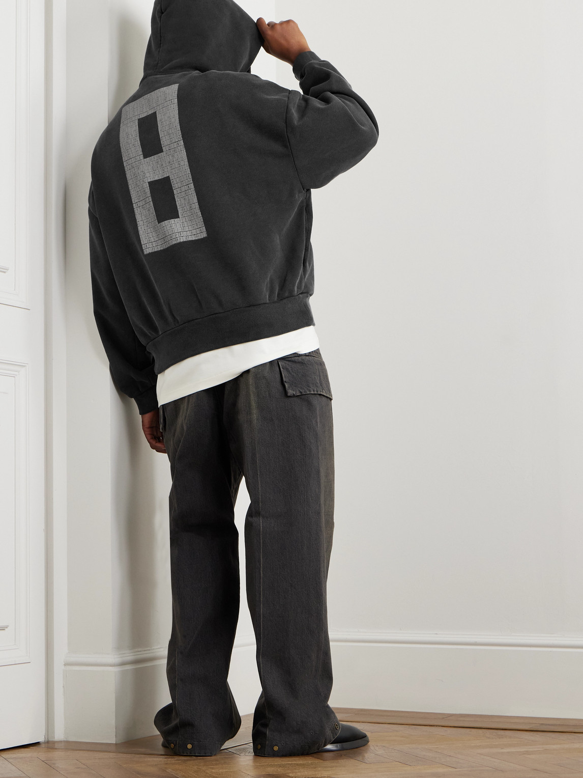 Shop Fear Of God Logo-print Cotton-jersey Hoodie In Black