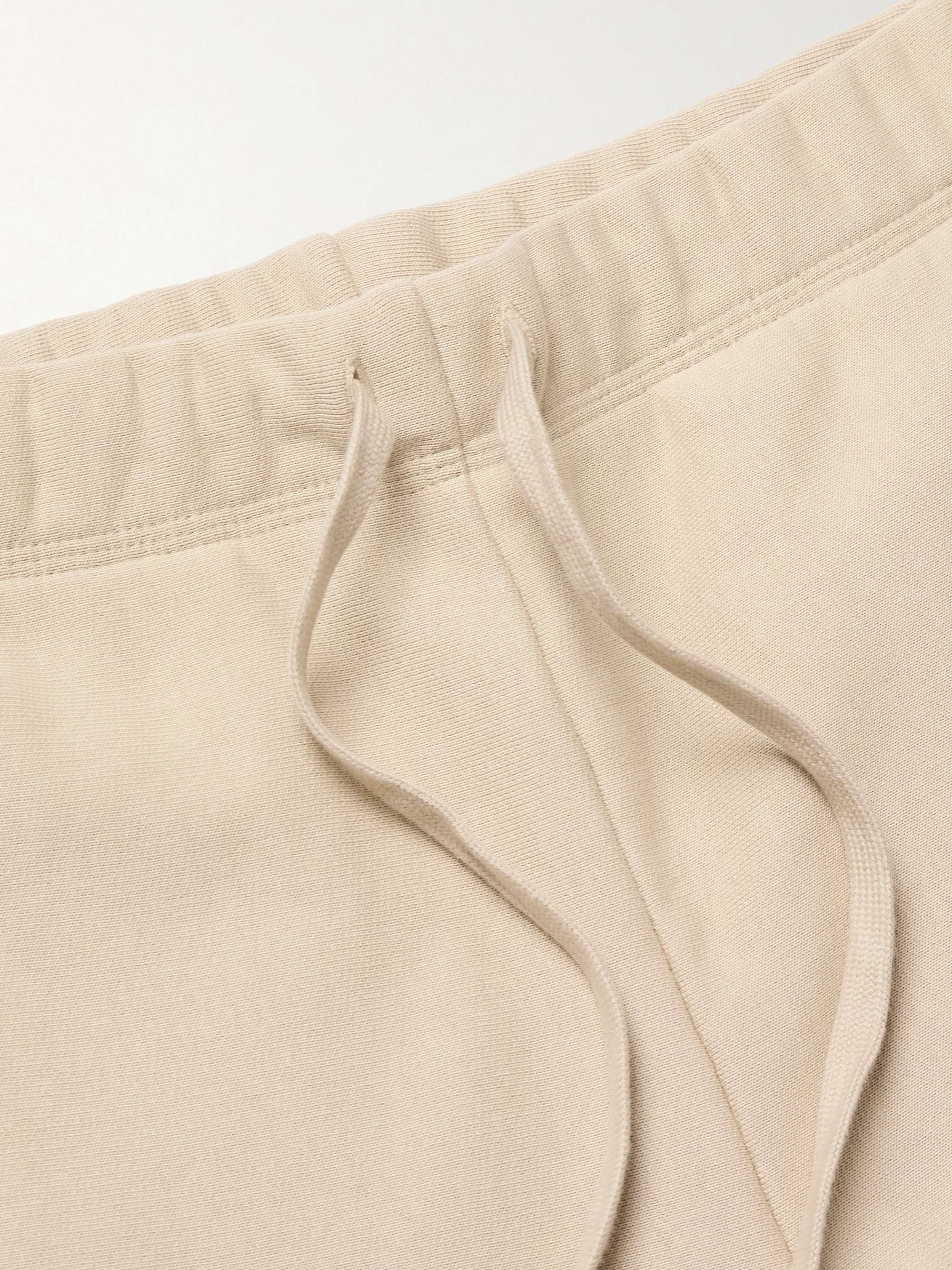 CARHARTT WIP 아메리칸 스크립트 테이퍼드 코튼 혼방 저지 스웨트팬츠