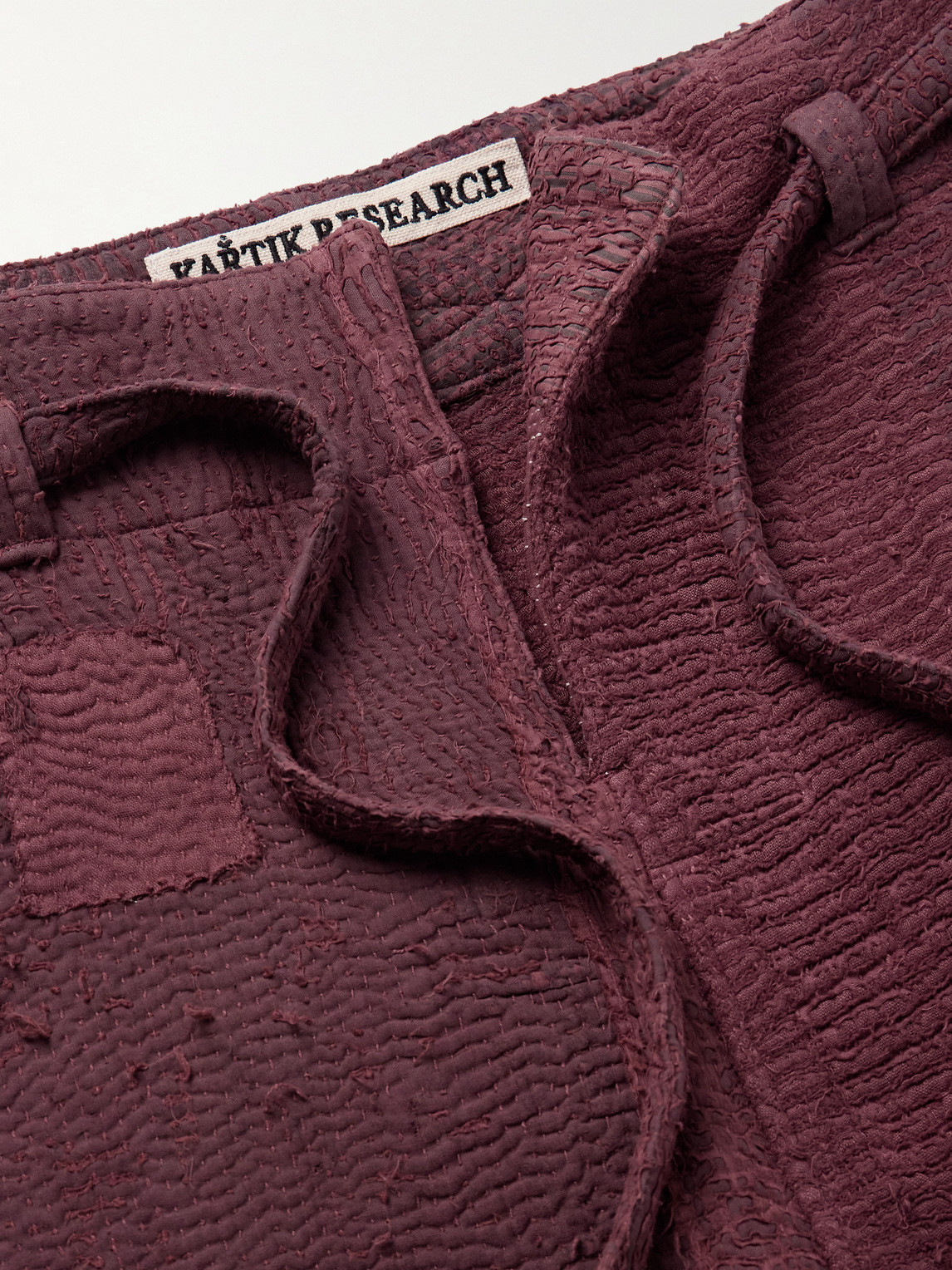 Shop Kartik Research Judo Belted Upcycled Textured-cotton Trousers In Burgundy