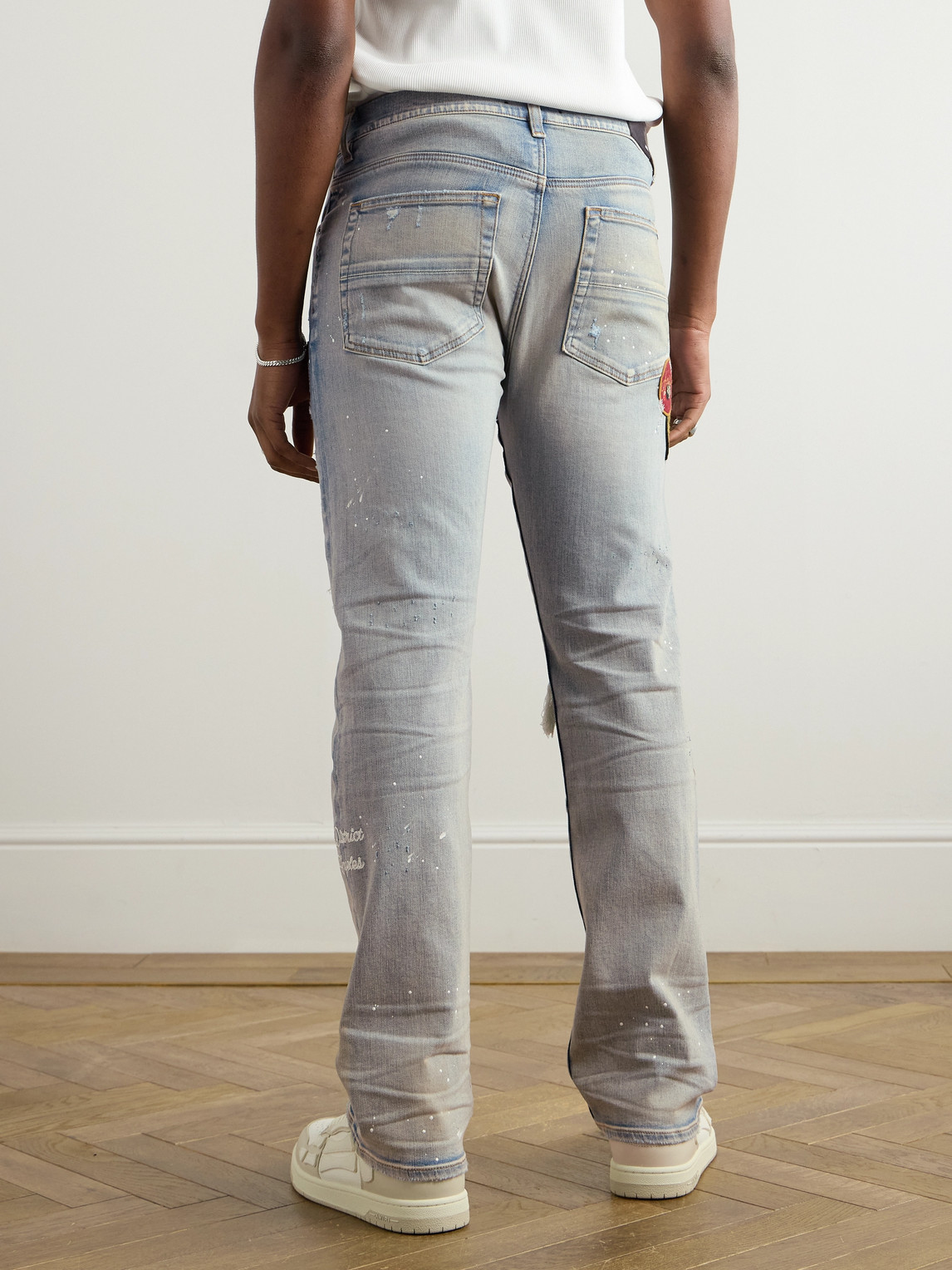 Shop Amiri Skinny-fit Appliquéd Distressed Paint-splattered Jeans In Blue