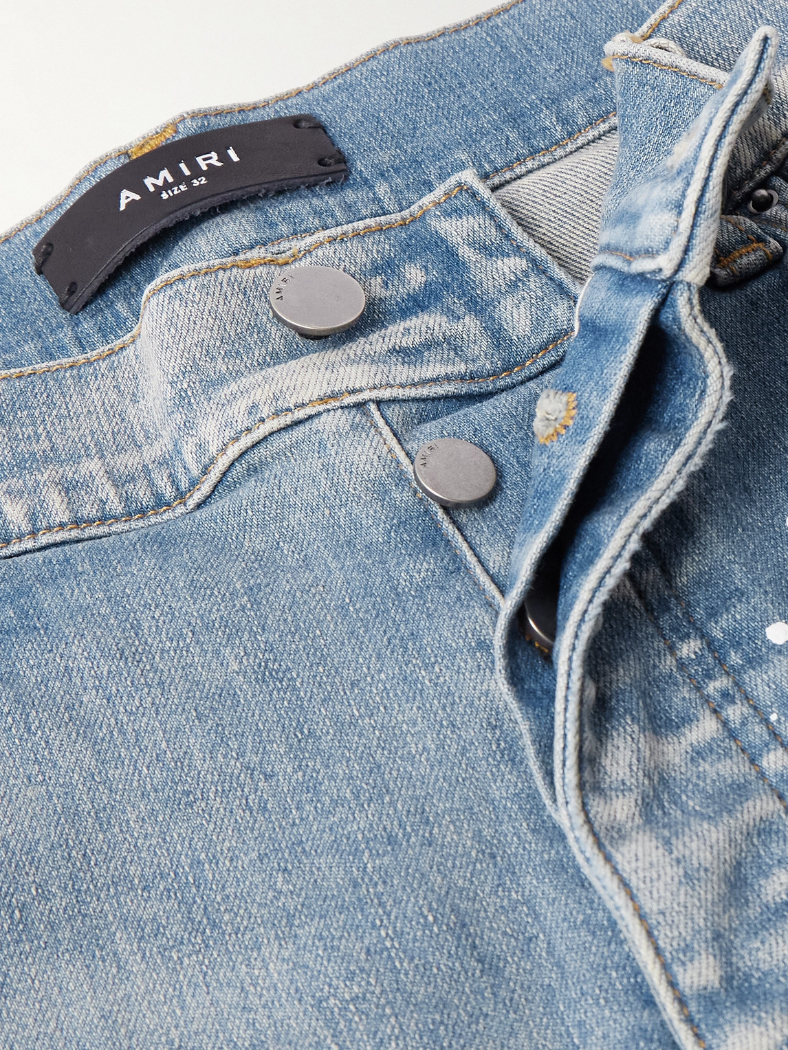 AMIRI SKINNY-FIT APPLIQUÉD DISTRESSED PAINT-SPLATTERED JEANS