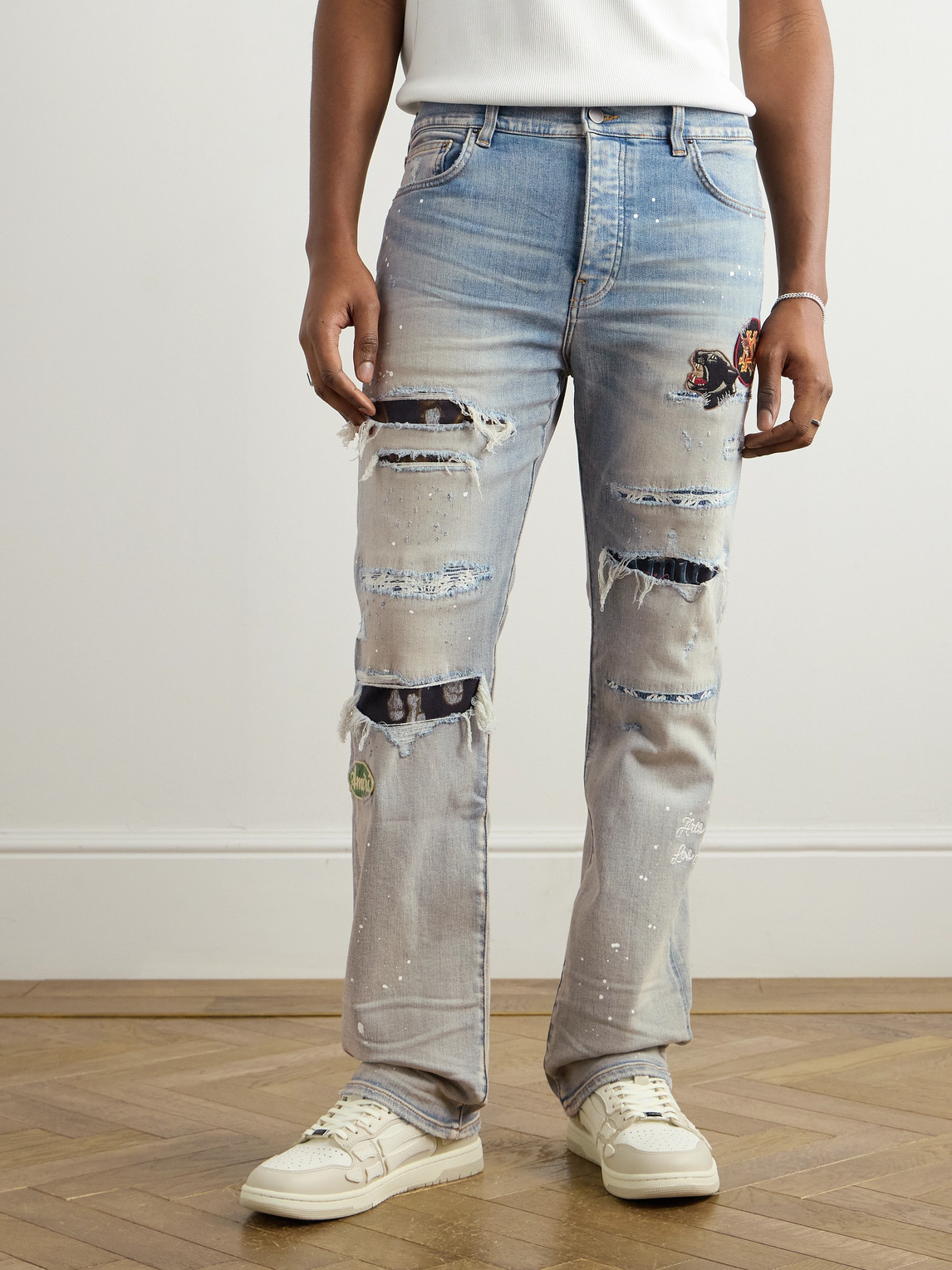 AMIRI SKINNY-FIT APPLIQUÉD DISTRESSED PAINT-SPLATTERED JEANS