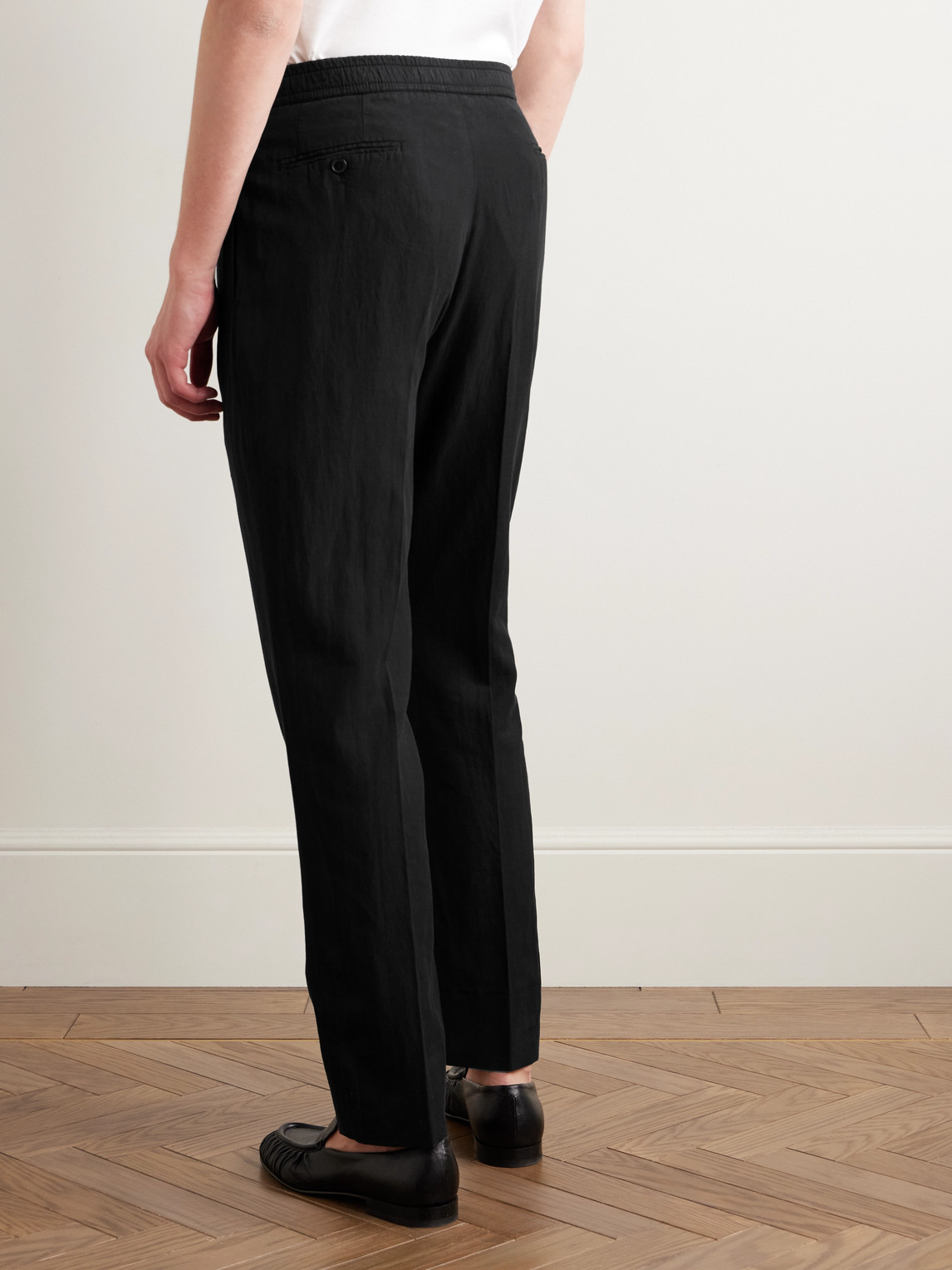 Officine Generale Drew Tapered Pleated Garment-dyed Lyocell-blend Trousers In Black
