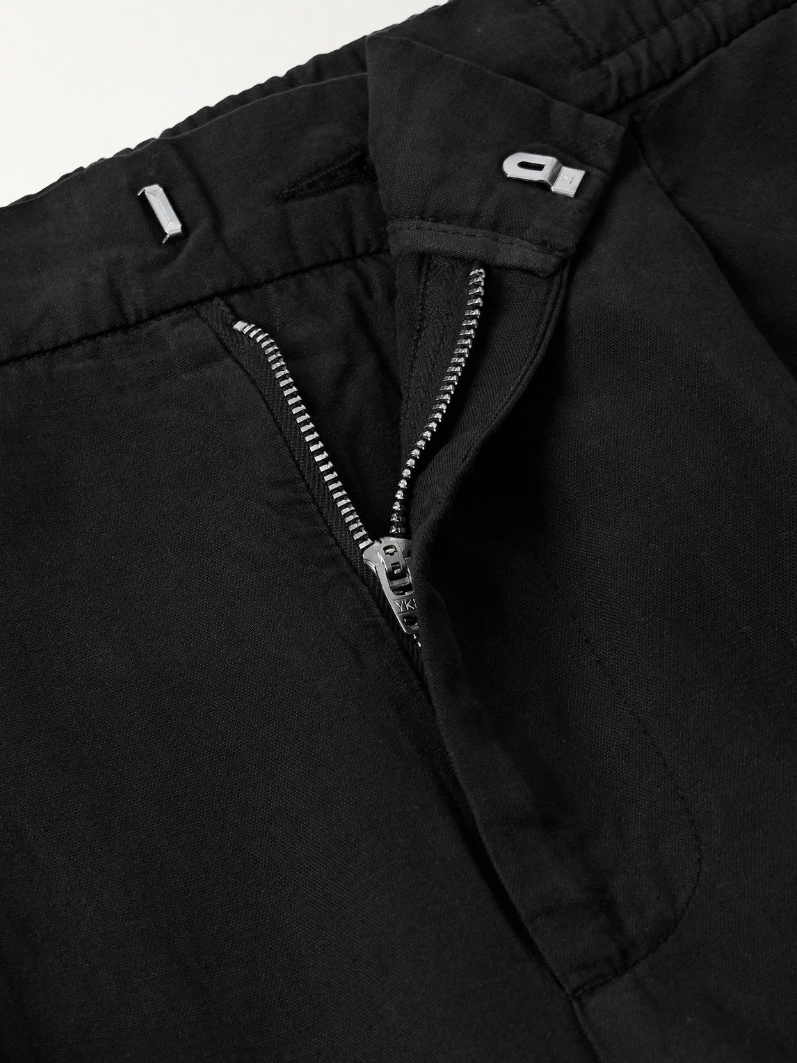 Officine Generale Drew Tapered Pleated Garment-dyed Lyocell-blend Trousers In Black