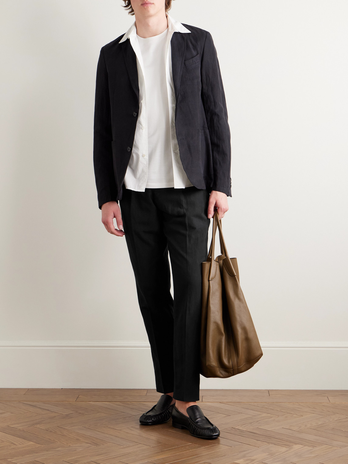 Officine Generale Drew Tapered Pleated Garment-dyed Lyocell-blend Trousers In Black