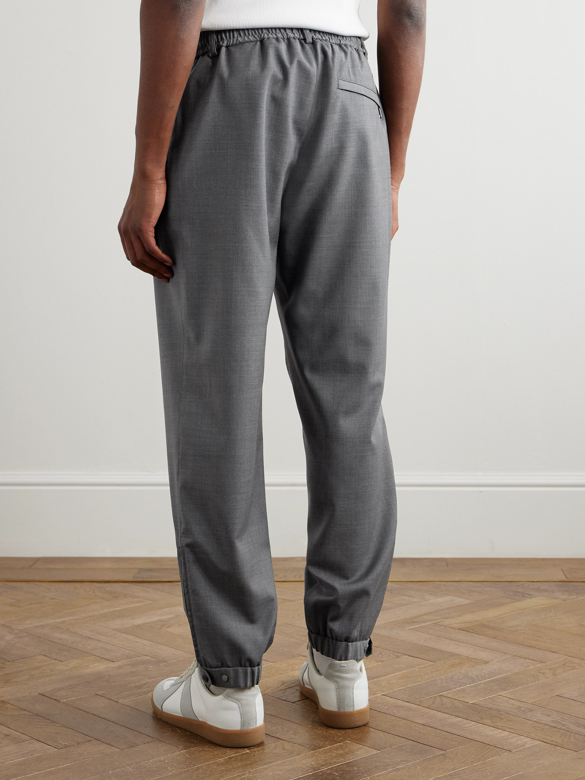Moncler Tapered Logo-appliquéd Wool Trousers In Gray