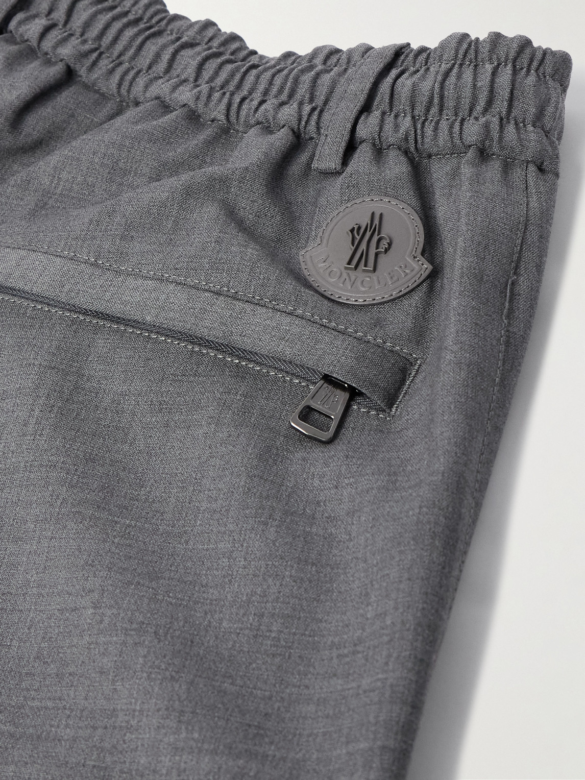 Moncler Tapered Logo-appliquéd Wool Trousers In Gray
