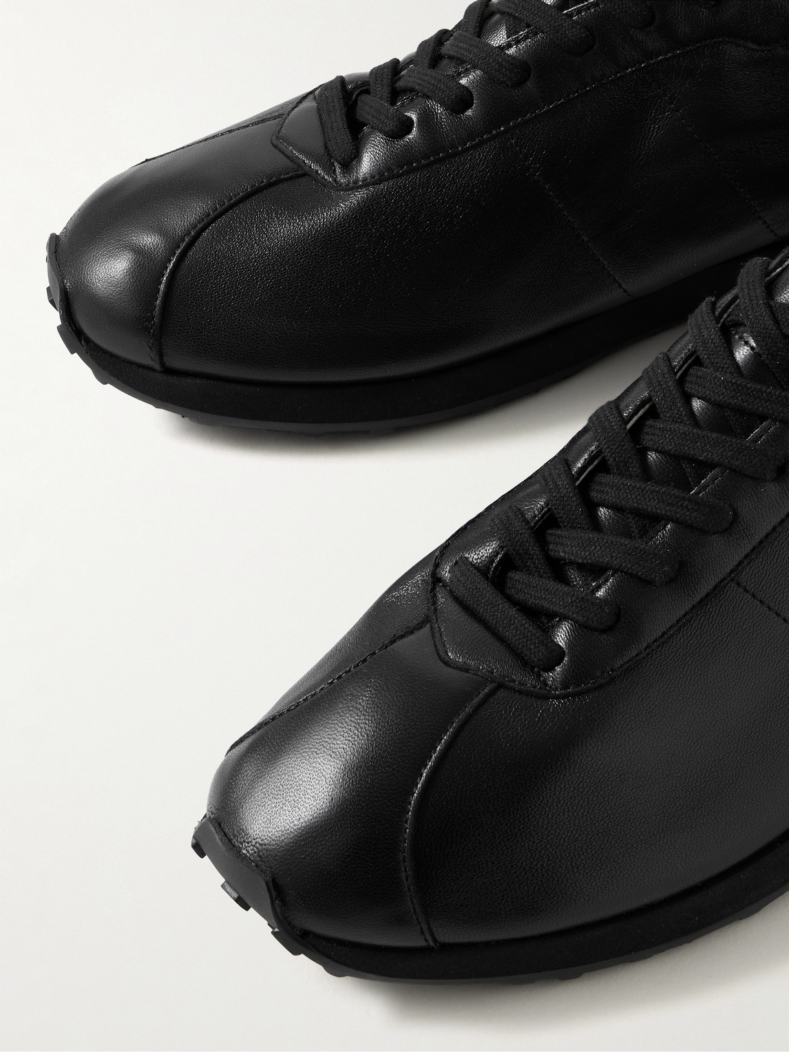 The Row Round Toe Rubber Sole Smooth Finish Sneakers In Black