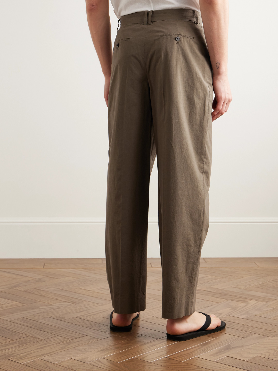 The Row Silas Tapered Pleated Cotton Trousers In Brown