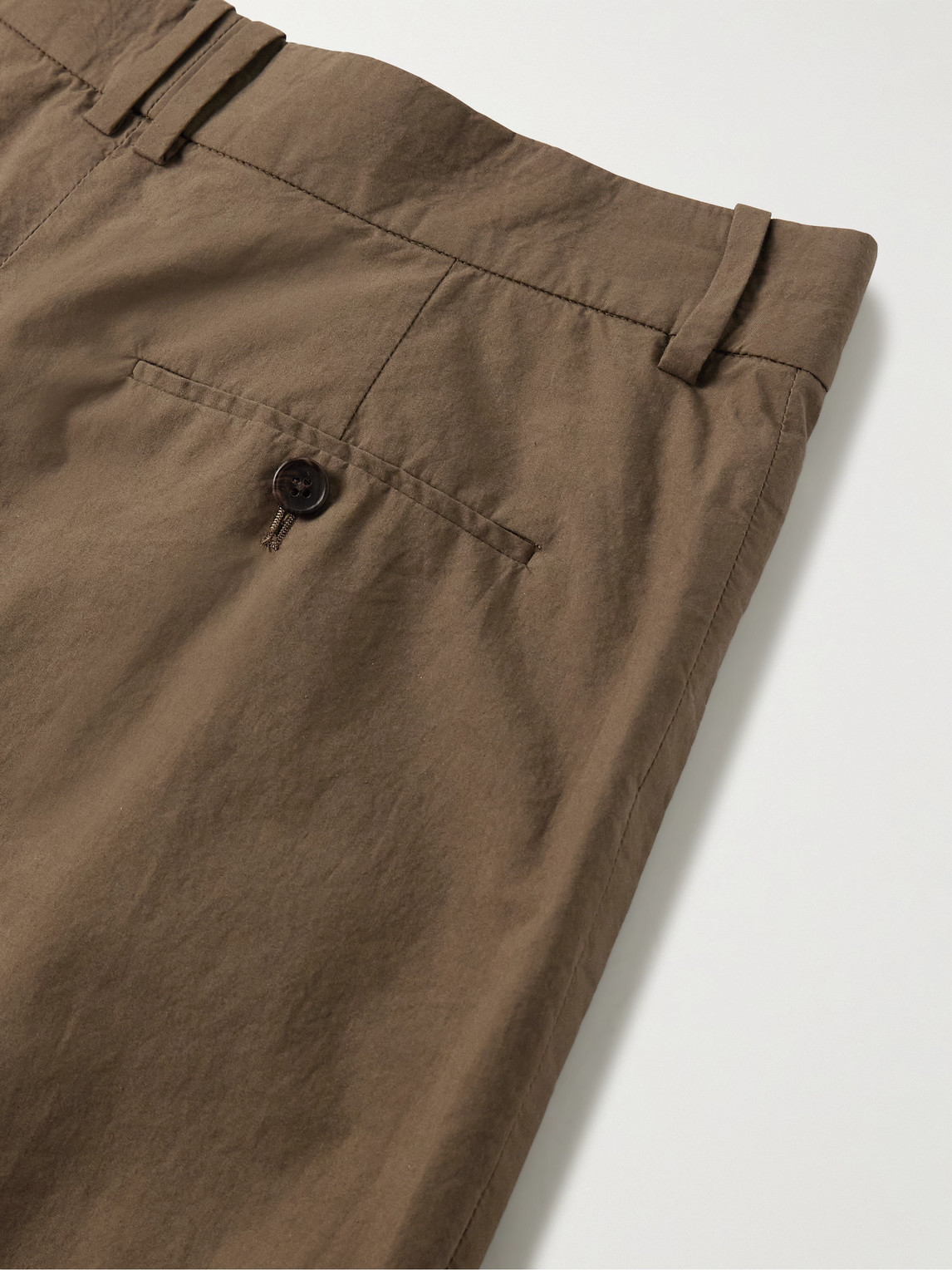 The Row Silas Tapered Pleated Cotton Trousers In Brown