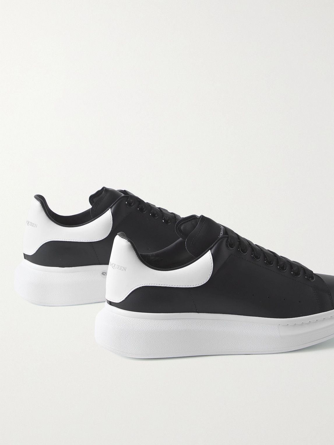 Shop Alexander Mcqueen Exaggerated-sole Leather Sneakers In Black