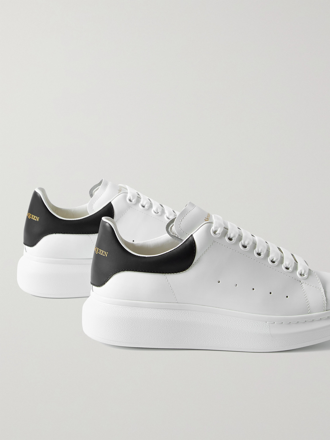 Shop Alexander Mcqueen Exaggerated-sole Leather Sneakers In White