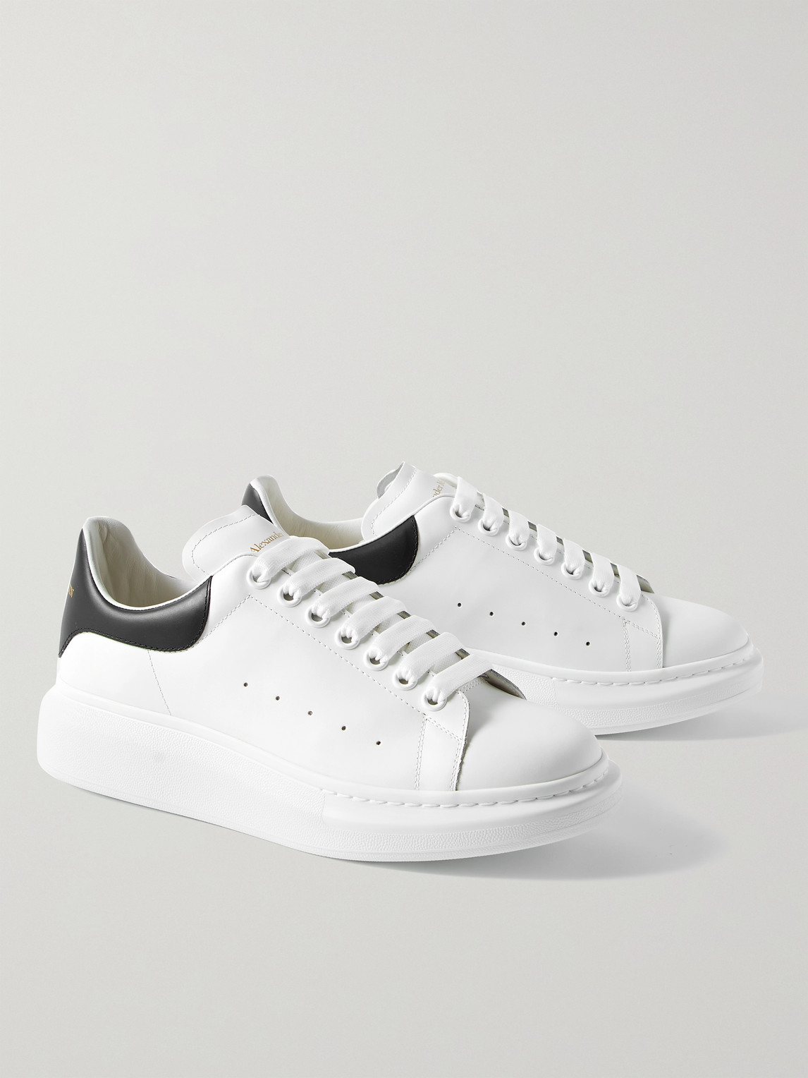 Shop Alexander Mcqueen Exaggerated-sole Leather Sneakers In White