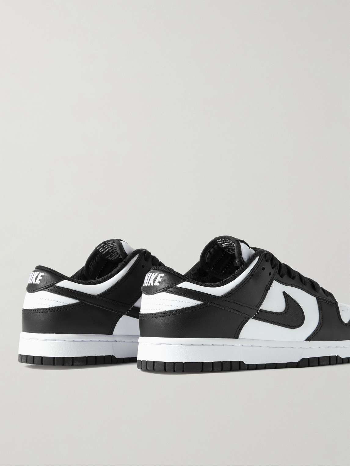 Shop Nike Dunk Low Retro Leather Sneakers In White