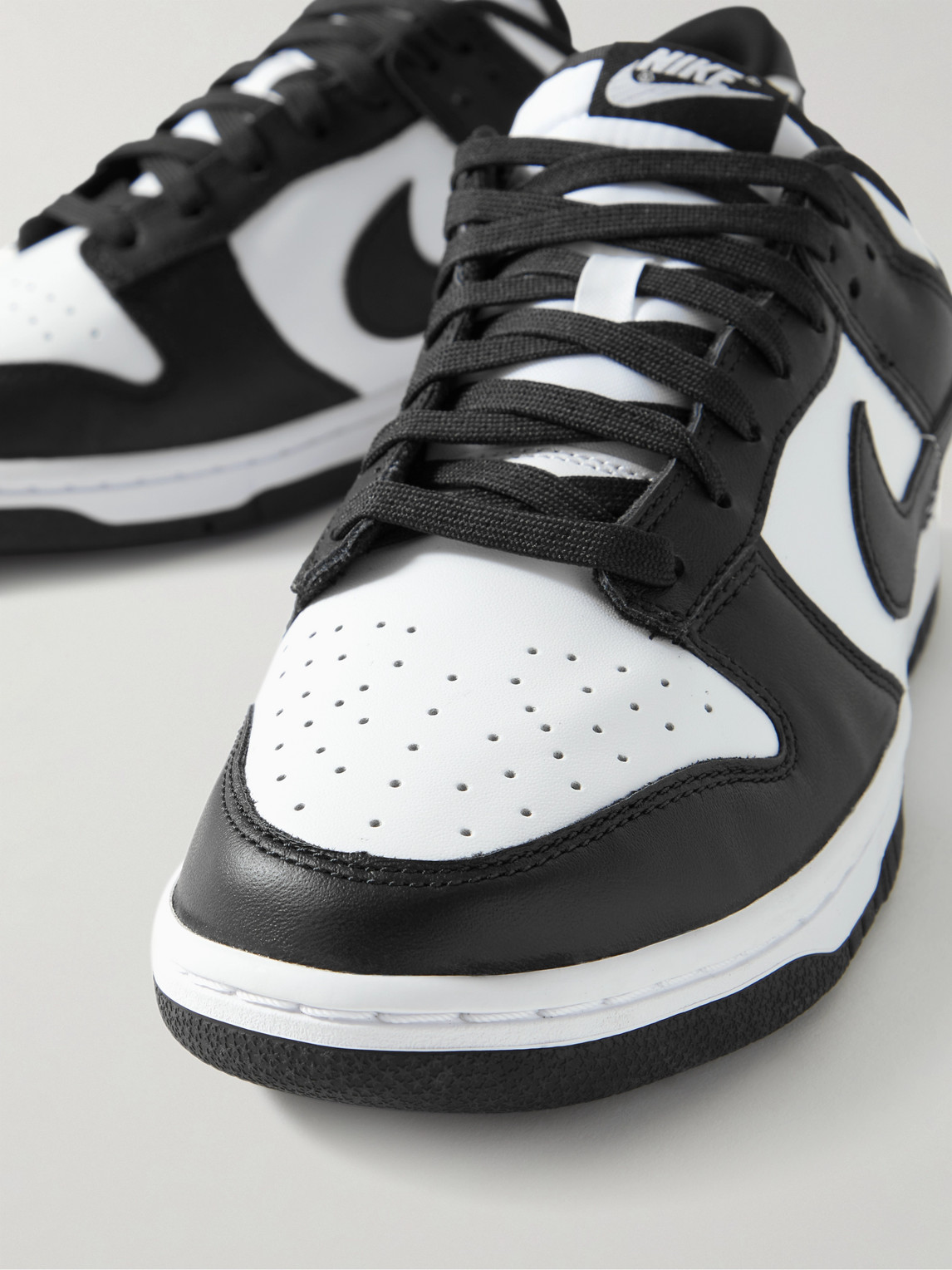 Shop Nike Dunk Low Retro Leather Sneakers In White