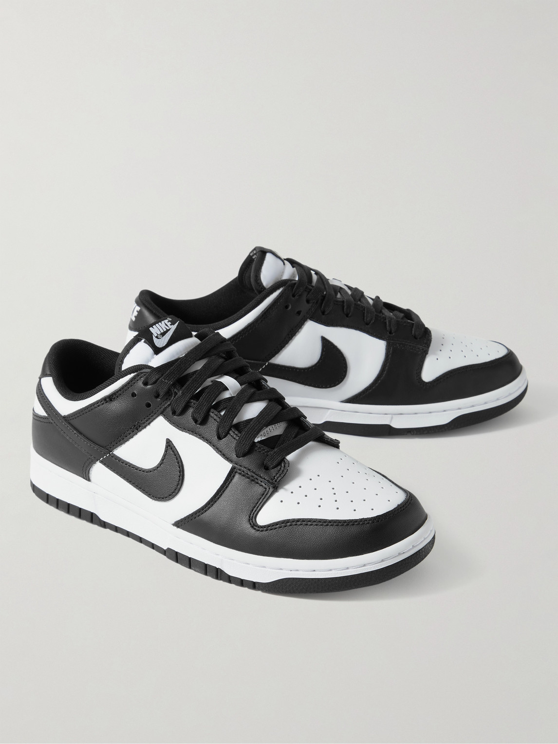 Shop Nike Dunk Low Retro Leather Sneakers In White