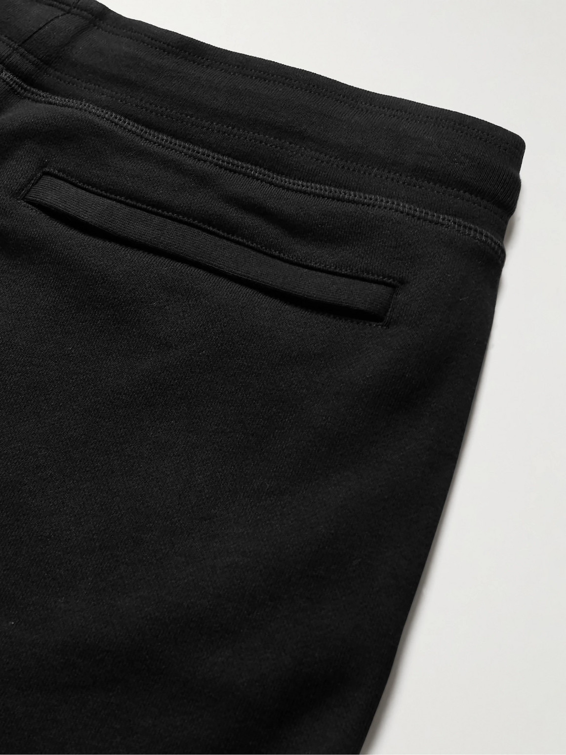 Shop Canada Goose Huron Tapered Logo-appliquéd Cotton-jersey Sweatpants In Black