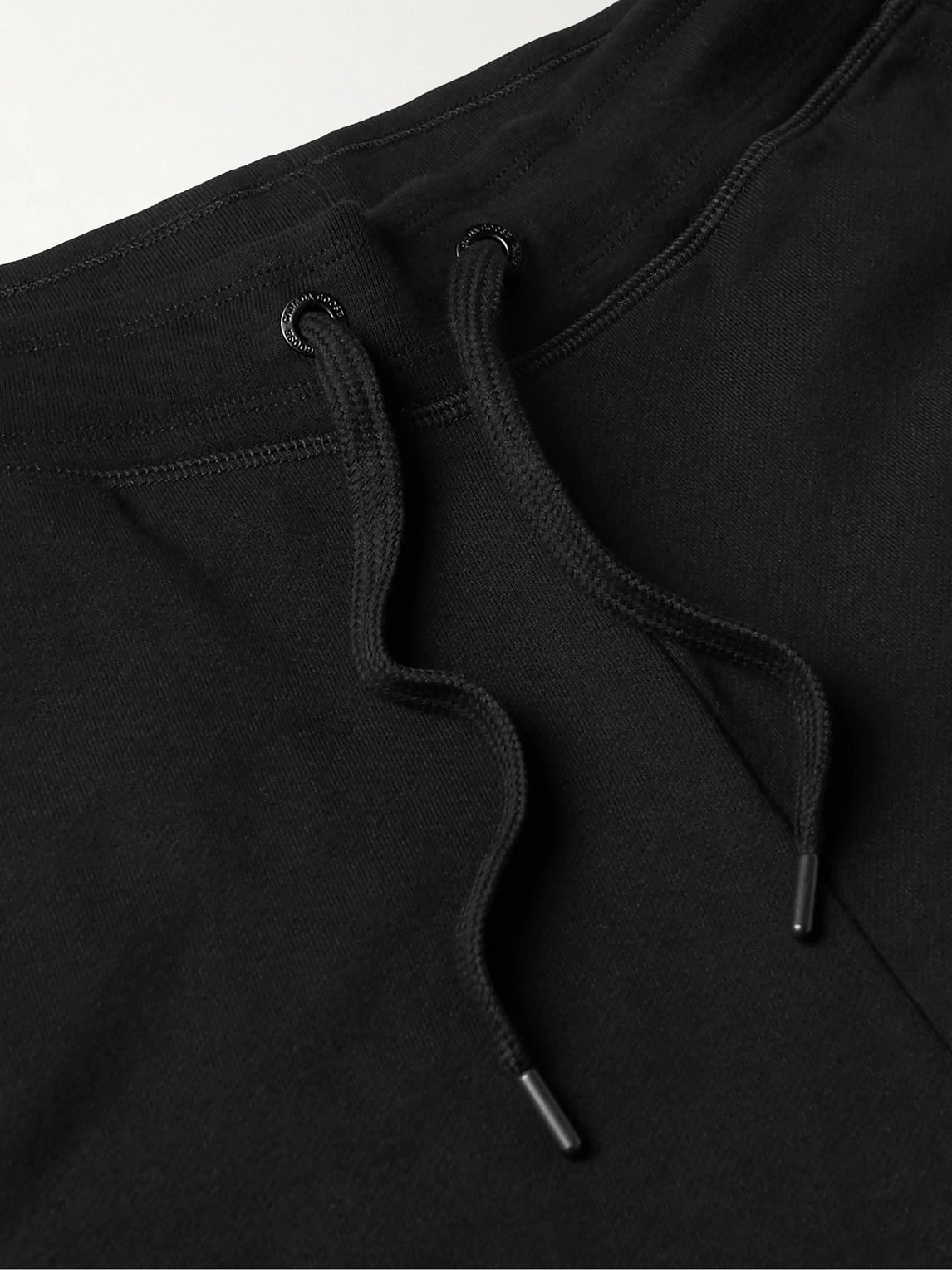 Shop Canada Goose Huron Tapered Logo-appliquéd Cotton-jersey Sweatpants In Black