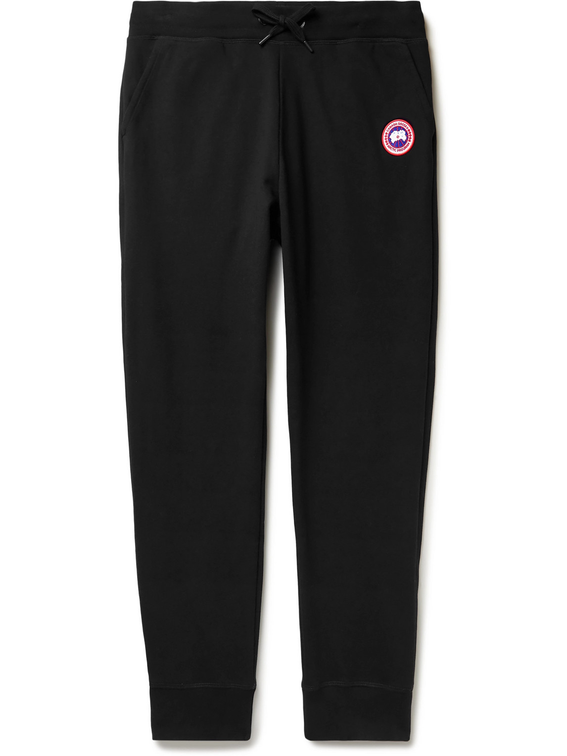 Shop Canada Goose Huron Tapered Logo-appliquéd Cotton-jersey Sweatpants In Black