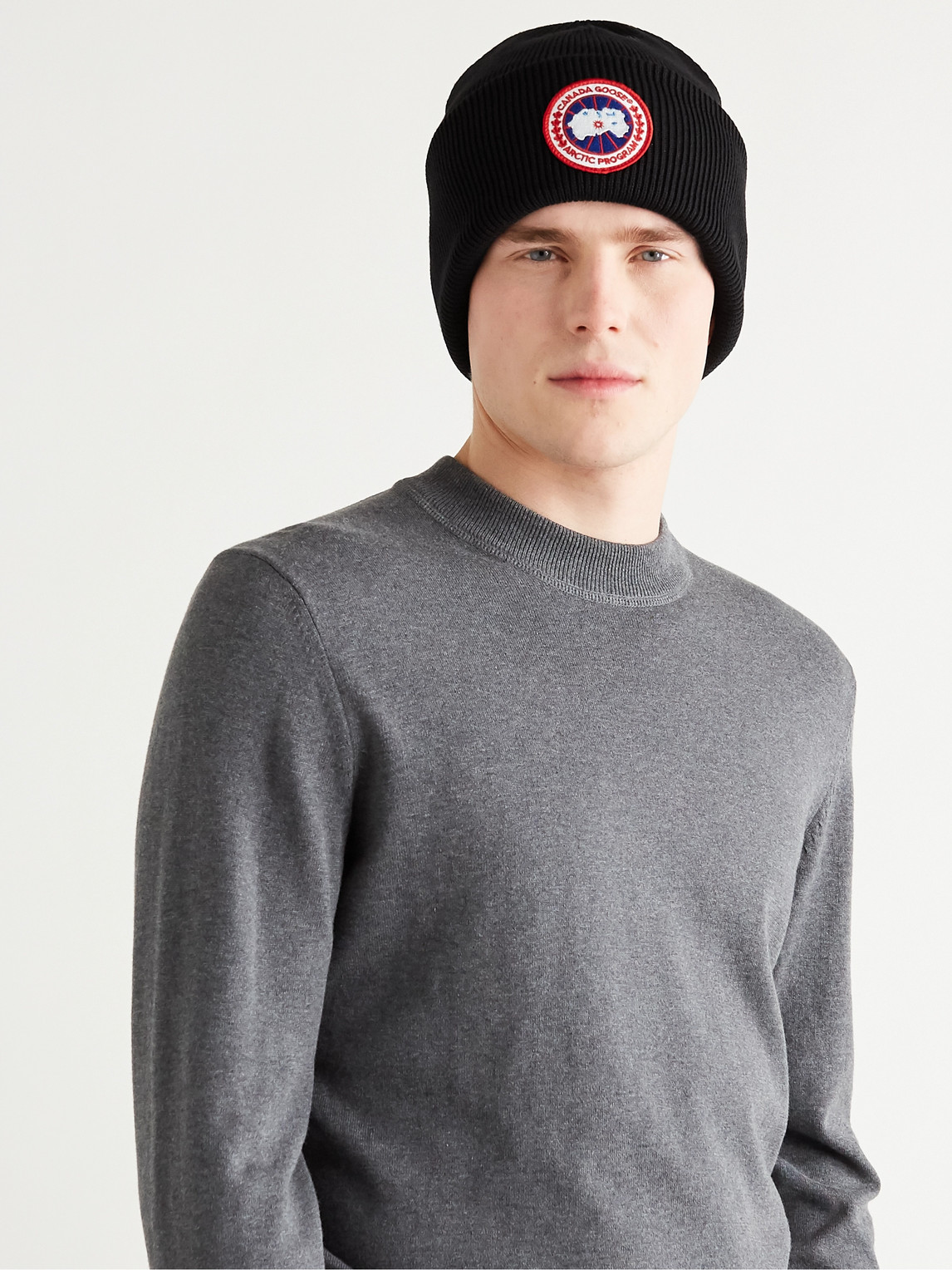 Shop Canada Goose Logo-appliquéd Merino Wool Beanie In Black