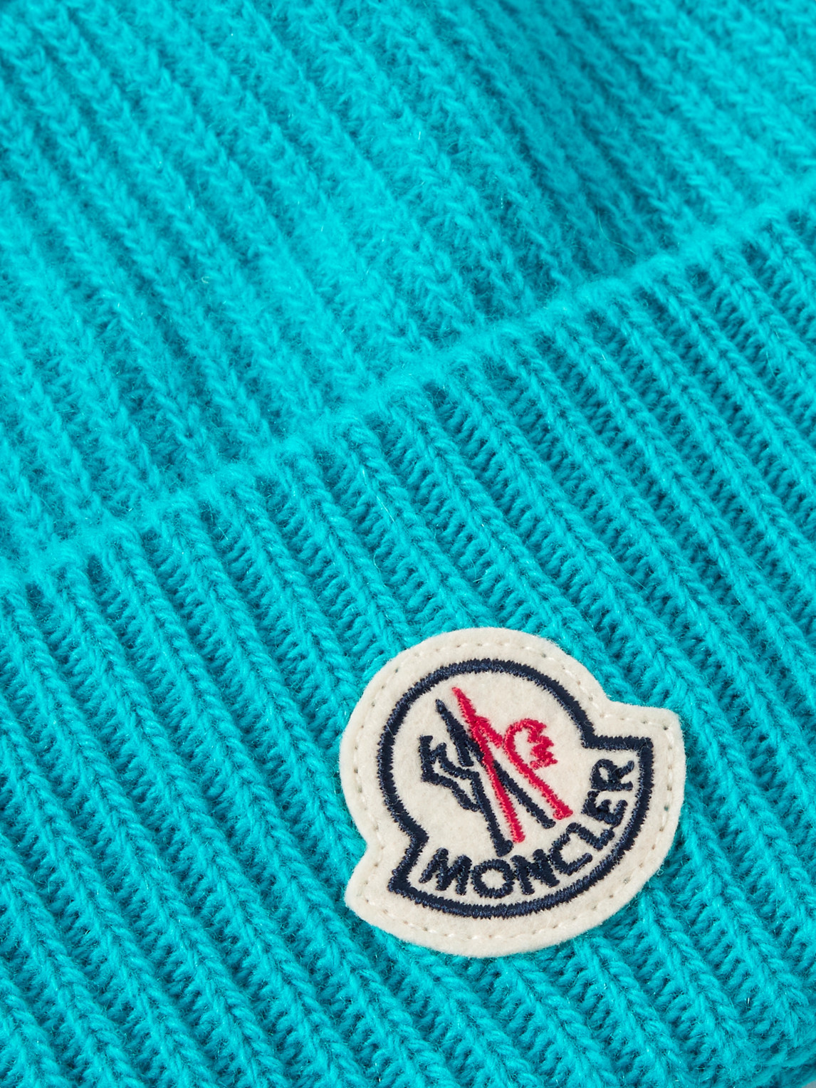 MONCLER APPLIQUÉD RIBBED VIRGIN WOOL AND CASHMERE-BLEND BEANIE 