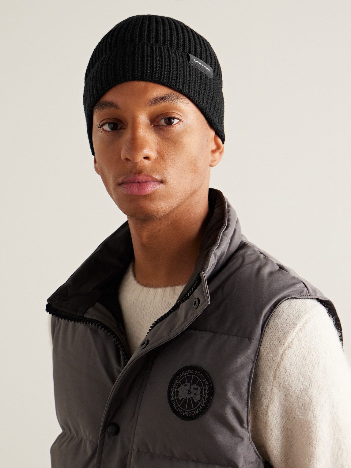Canada Goose Logo-appliquéd Ribbed Wool Beanie In Black