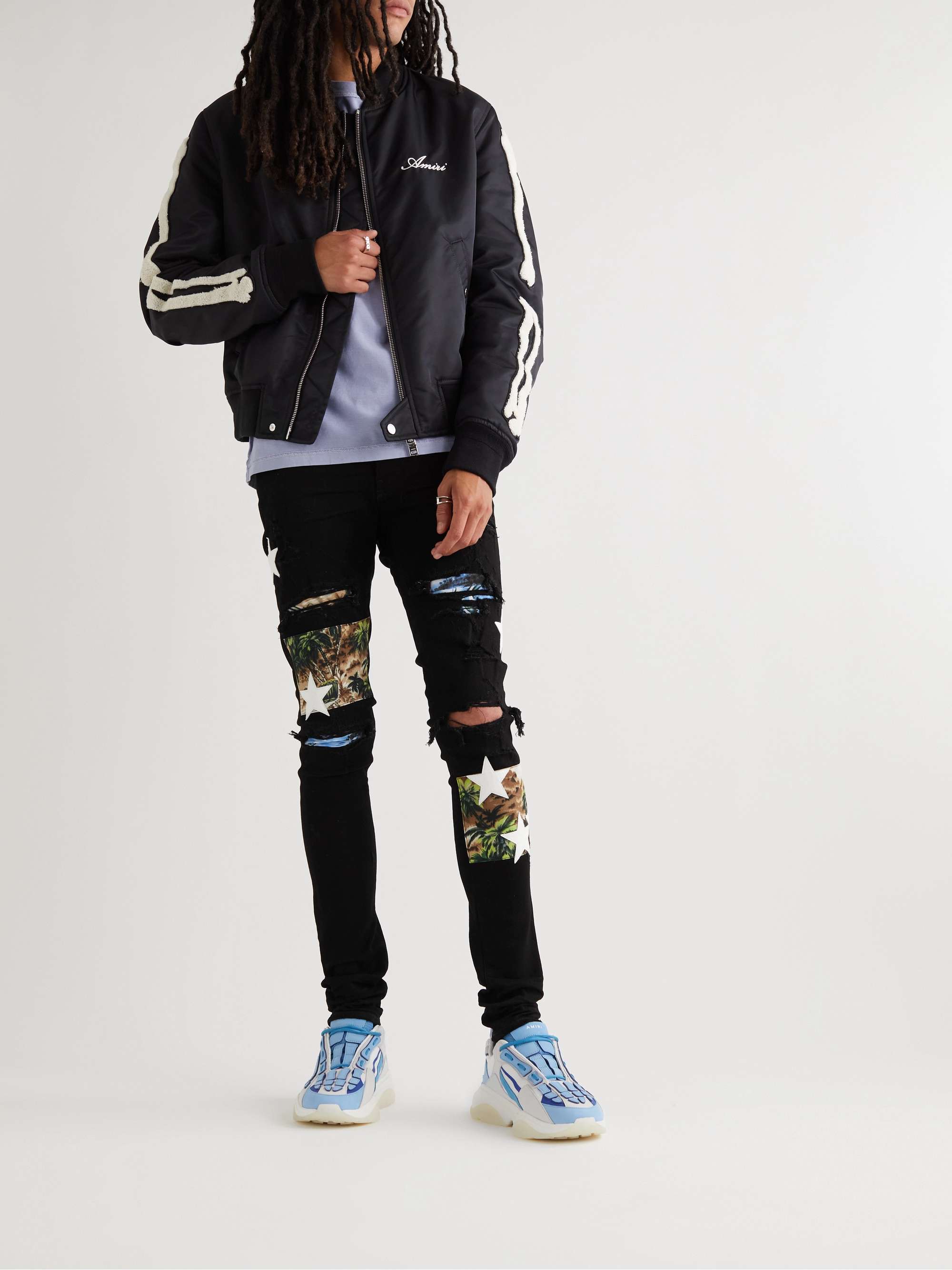 AMIRI Skinny-Fit Leather-Appliquéd Panelled Distressed Jeans