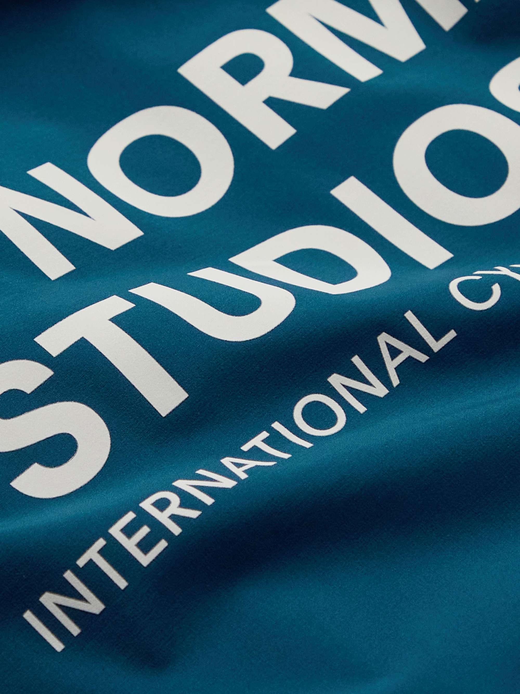 PAS NORMAL STUDIOS Essential Shield Logo-Print Nylon Cycling Jacket