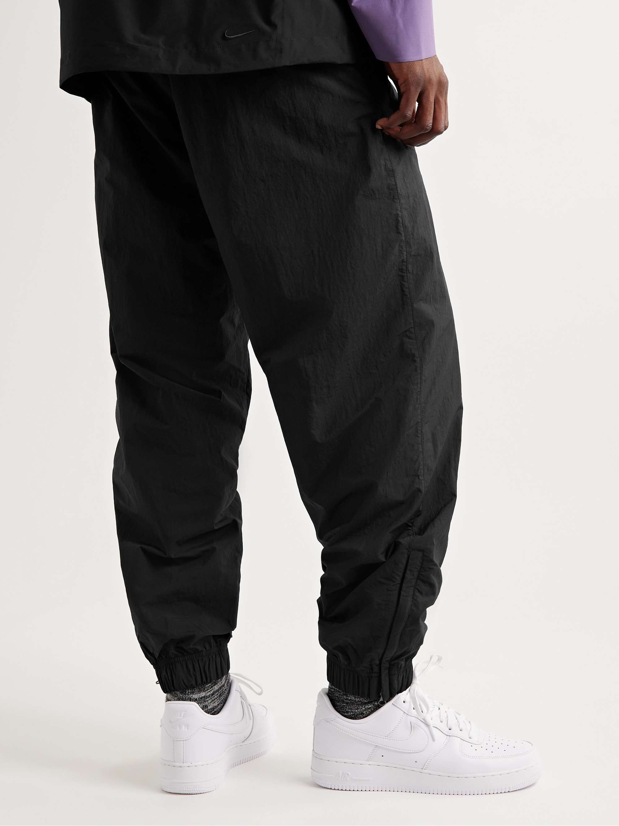 NIKE Solo Swish Tapered Logo-Embroidered Shell Track Pants
