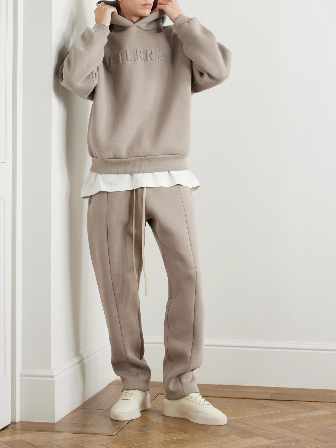 Shop Fear Of God Eternal Logo-embossed Cotton-blend Jersey Hoodie In Brown