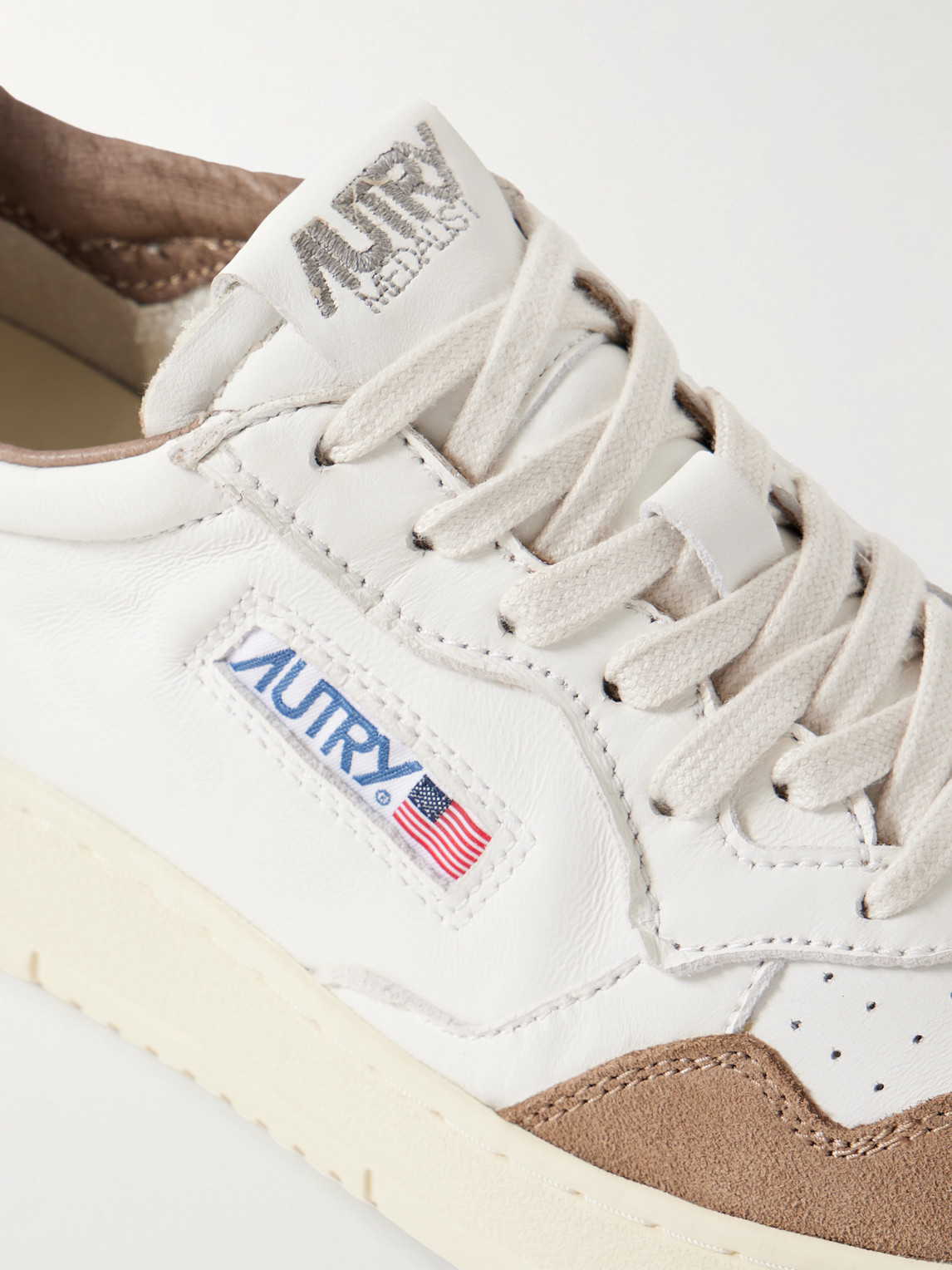 Autry Low Sneaker With Suede Accents And Perforated Toe Box