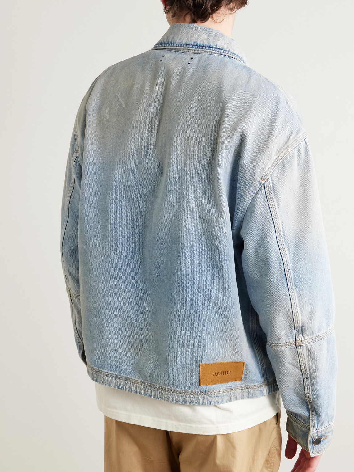 Amiri Logo-appliquéd Distressed Denim Jacket In Blue