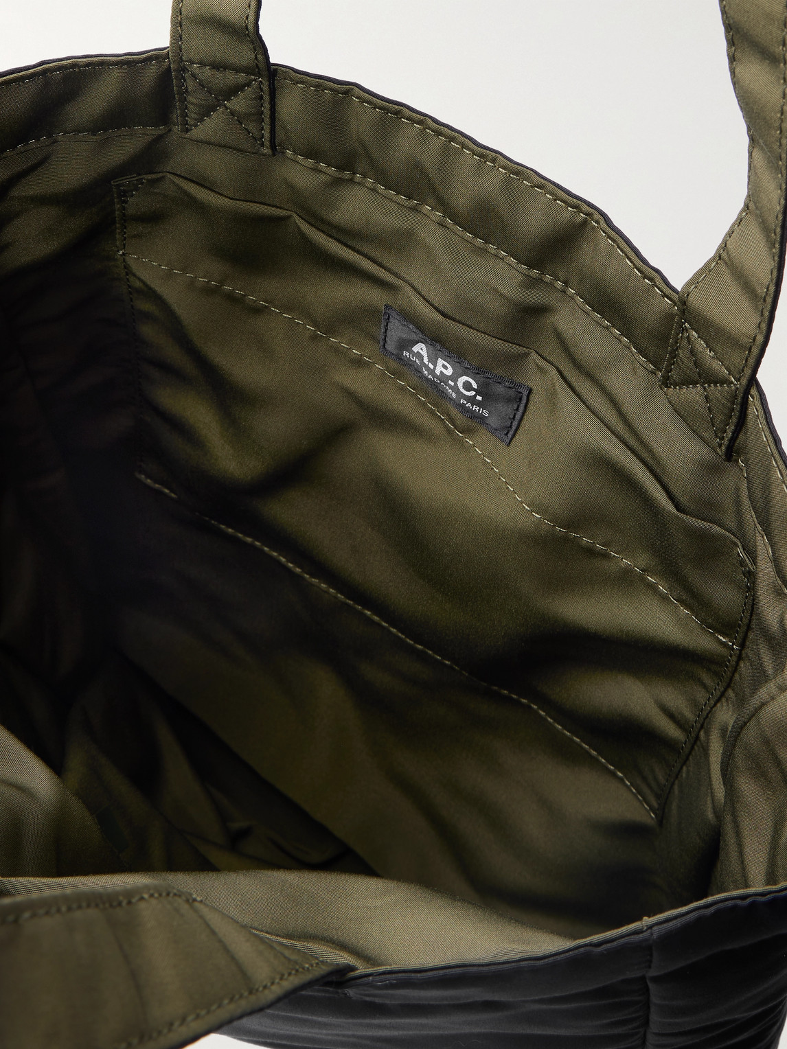 Apc Logo-print Reversible Quilted Crepe Tote Bag In Black