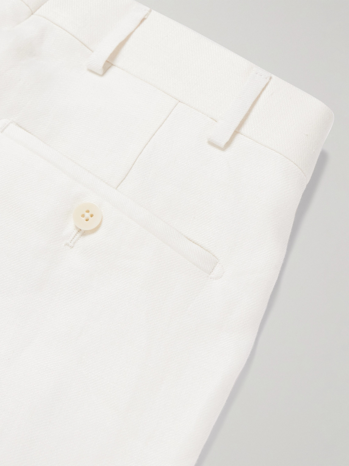 Shop Kingsman Tapered Pleated Herringbone Linen-twill Suit Trousers