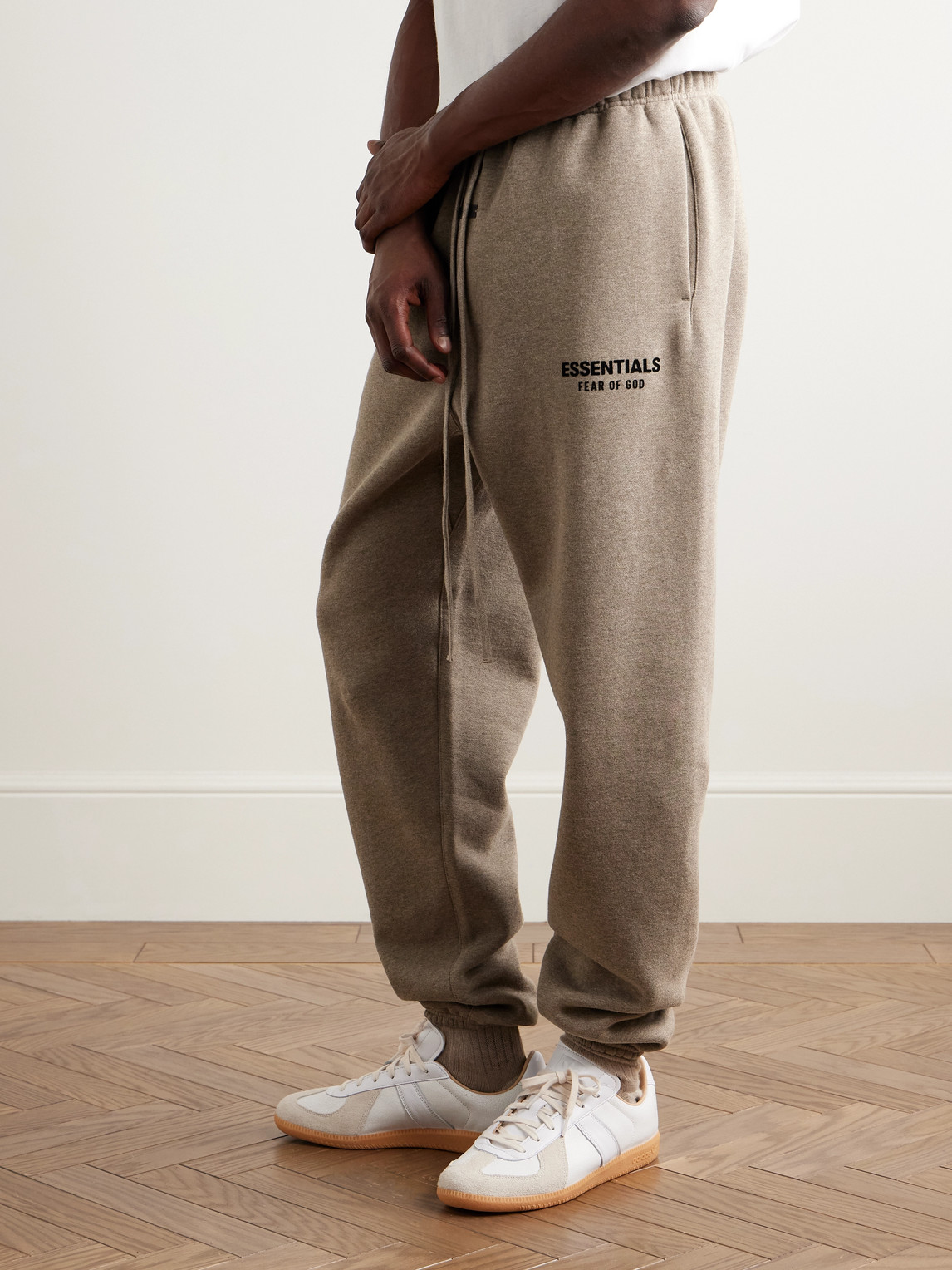 Essentials Tapered Logo-appliquéd Cotton-blend Jersey Sweatpants In Brown