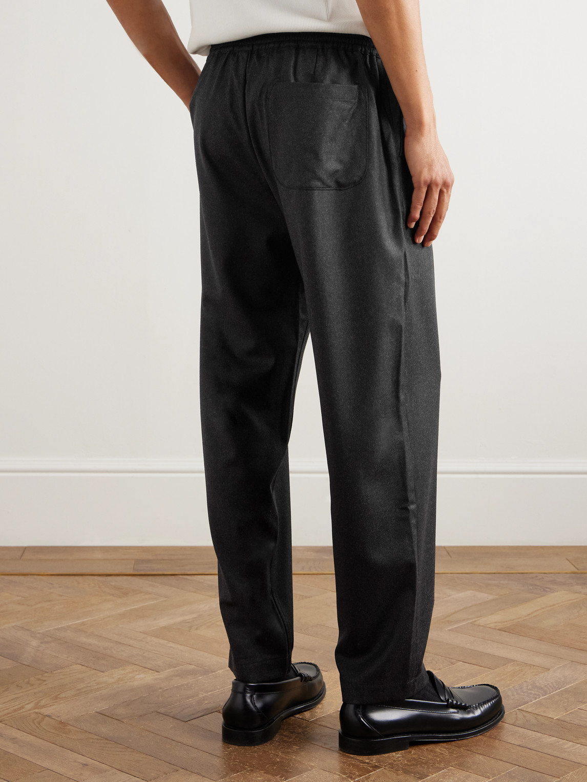 A Kind Of Guise Banasa Tapered Virgin Wool Trousers In Black
