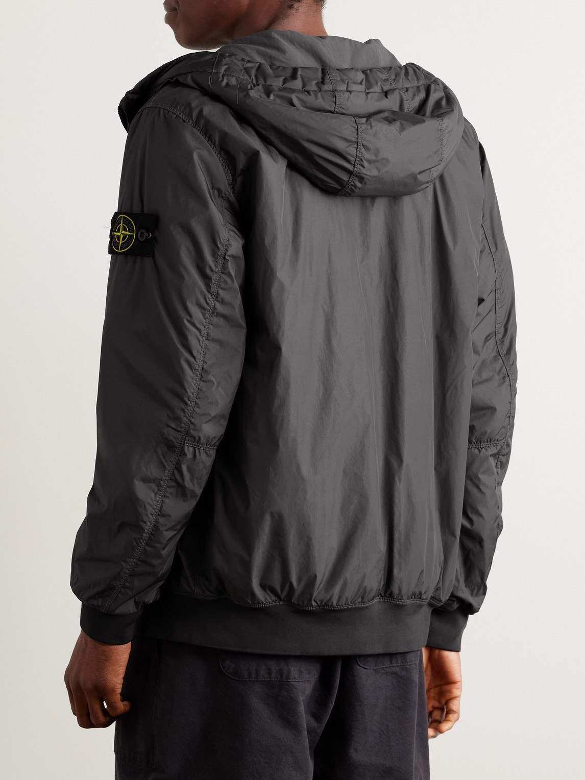 Stone Island Logo-appliquéd Garment-dyed Padded Crinkle Reps Nylon Hooded Jacket In Black