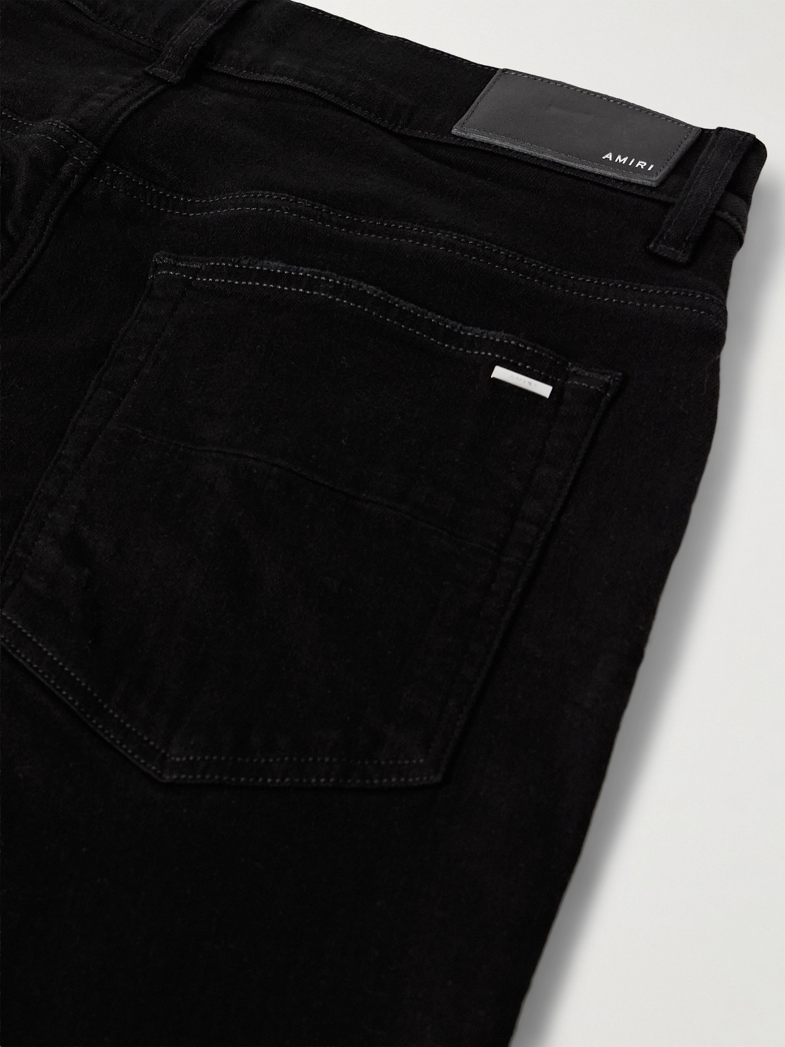 Amiri Mx1 Skinny-fit Leather-panelled Distressed Jeans In Black